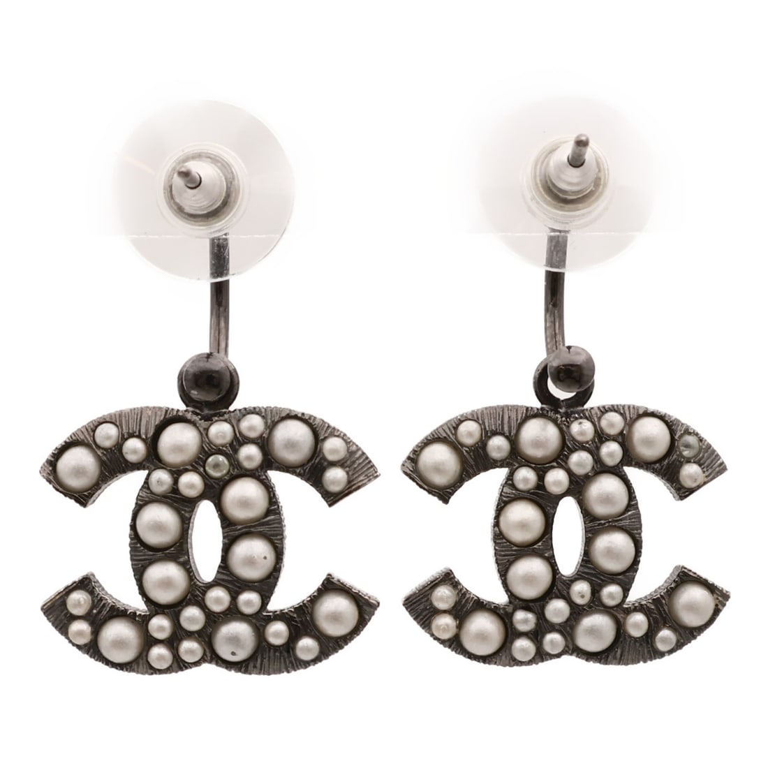 Black and White Metal Pierced Earrings by CHANEL CC: Black and White Metal Pierced Earrings by CHANEL CC These CHANEL pierced earrings feature the signature CC logo in a sleek black and white color combination. Crafted from unspecified metal and materia