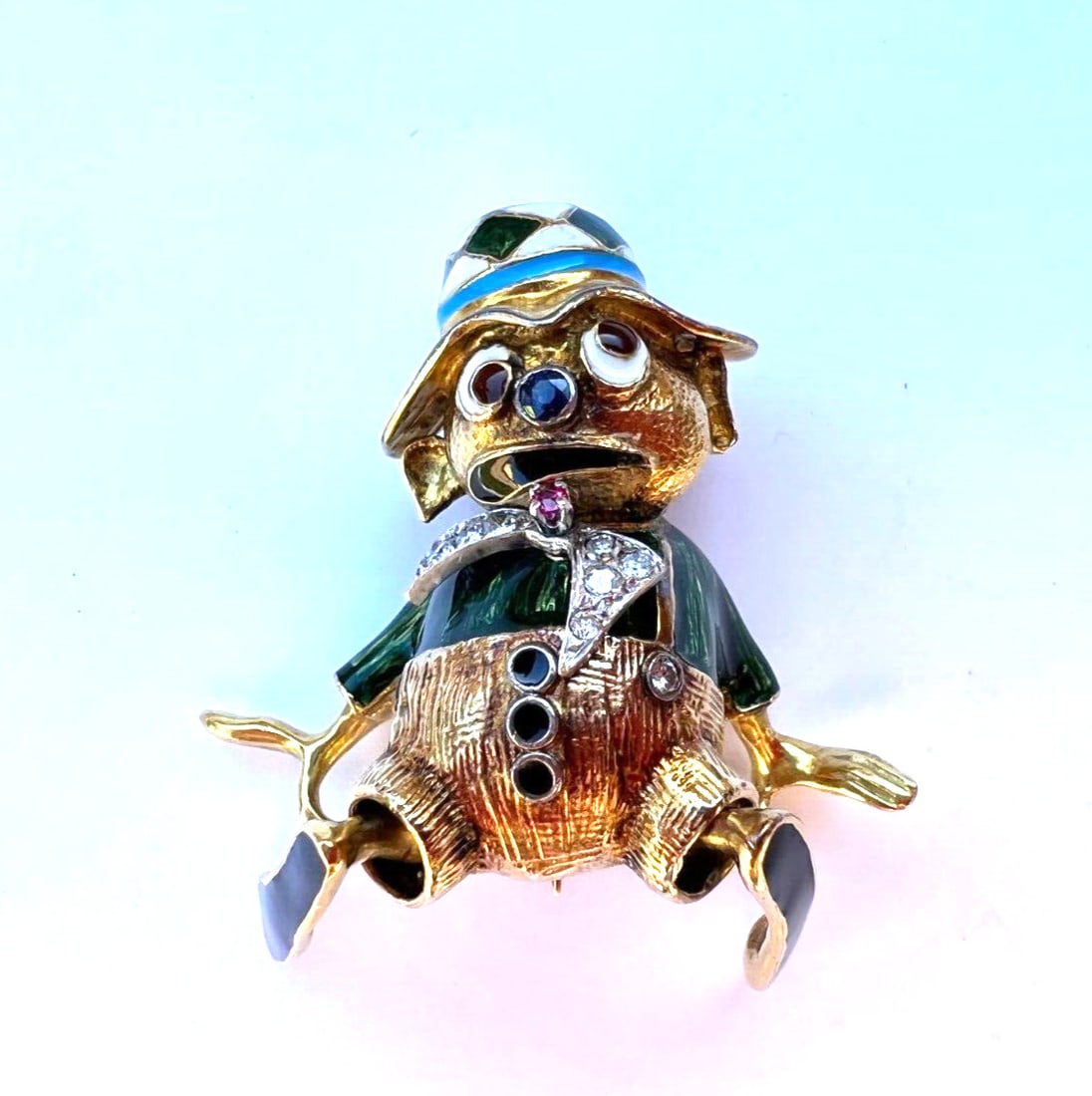 1950s French 18K Gold Diamond Sapphire Ruby Enamel Brooch: 1950s French 18K Gold Diamond Sapphire Ruby Enamel Brooch This magnificent 1950's French brooch features exquisite craftsmanship in 18K yellow gold, adorned with dazzling diamonds, sapphires, and rubi