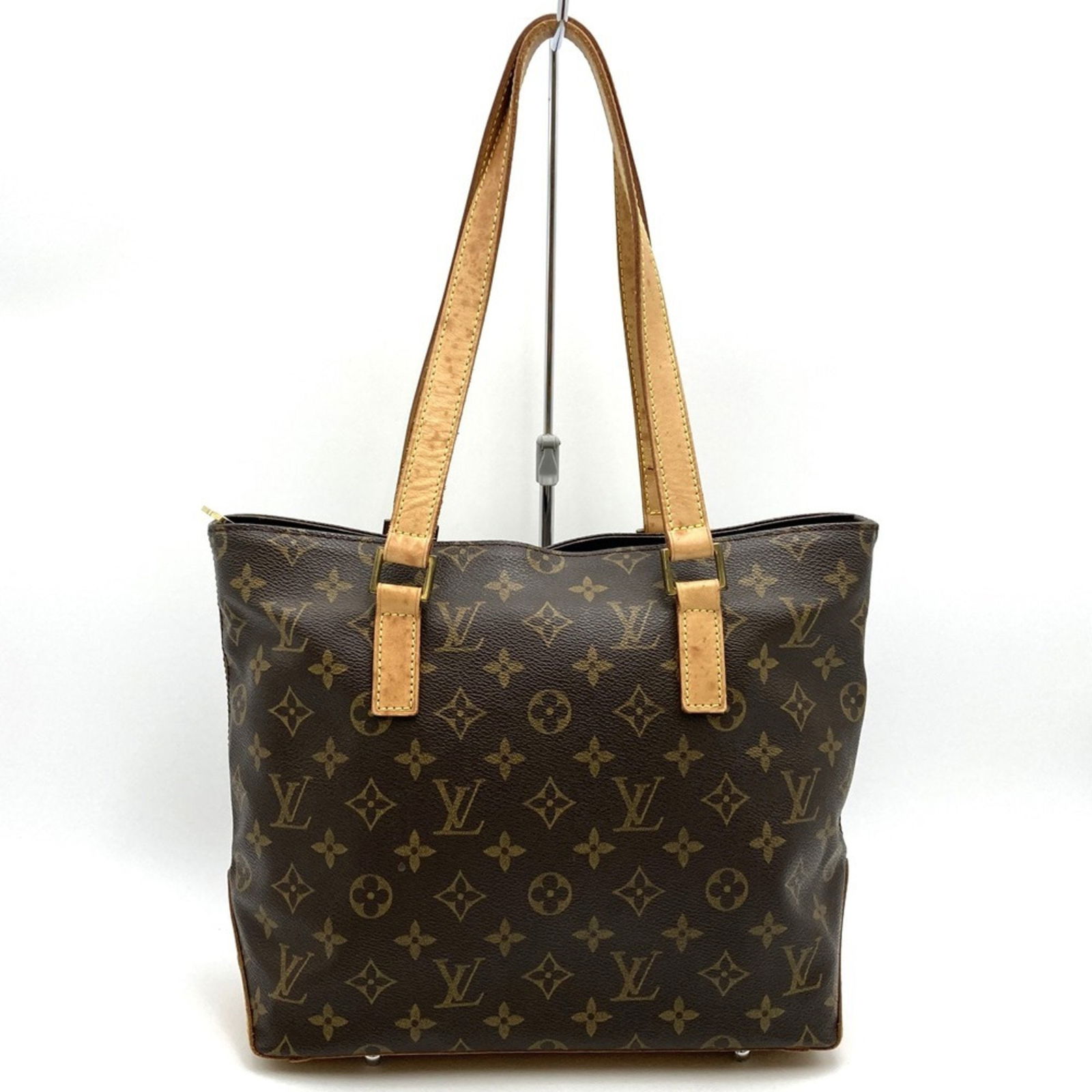 Piano tote in brown canvas by Louis Vuitton France: Piano tote in brown canvas by Louis Vuitton France This Louis Vuitton Piano handbag features a brown canvas exterior and is designed for women. The bag is crafted in France and features a spacious int