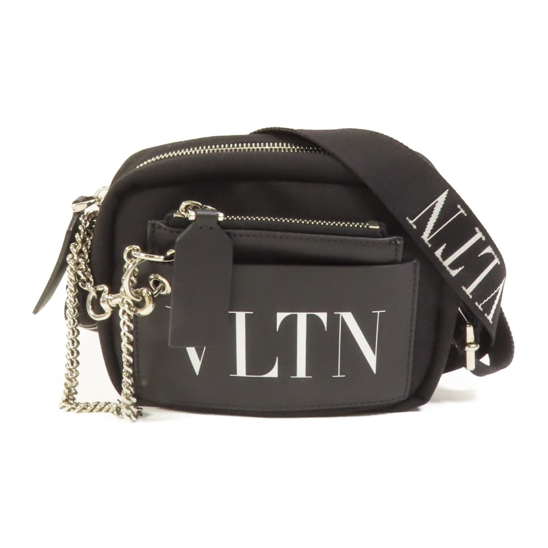 Black Canvas Valentino Garavani VLTN Shoulder Bag with Silver Hardware: Black Canvas Valentino Garavani VLTN Shoulder Bag with Silver Hardware This Valentino shoulder bag features a black canvas exterior and a sleek, compact design. The bag is in very good condition and o
