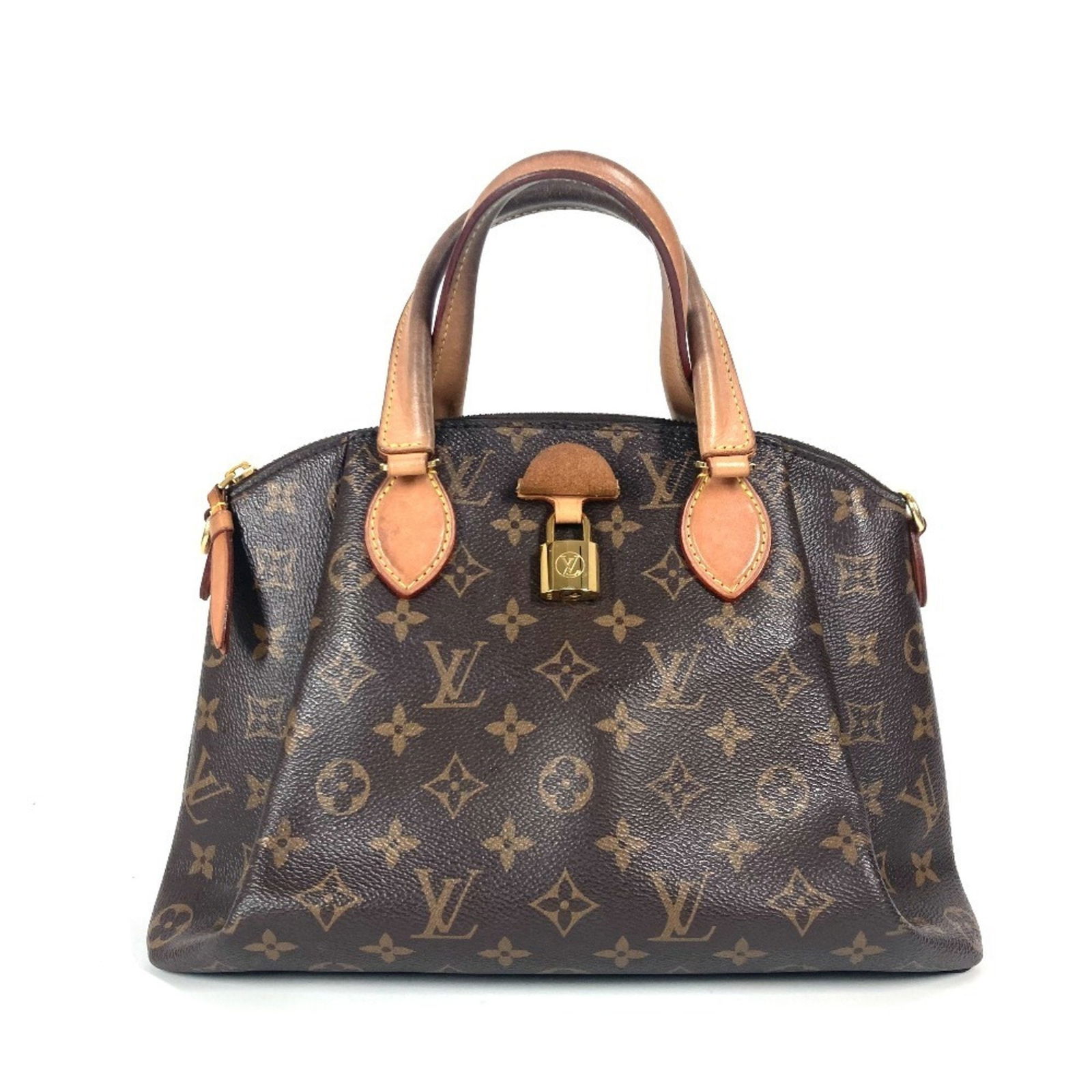 Louis Vuitton Rivoli Brown Canvas Bag France: Louis Vuitton Rivoli Brown Canvas Bag France The Louis Vuitton Rivoli is a brown canvas bag designed for women. Made in France, it features traces of use with some scratches and dirt on the exterior,