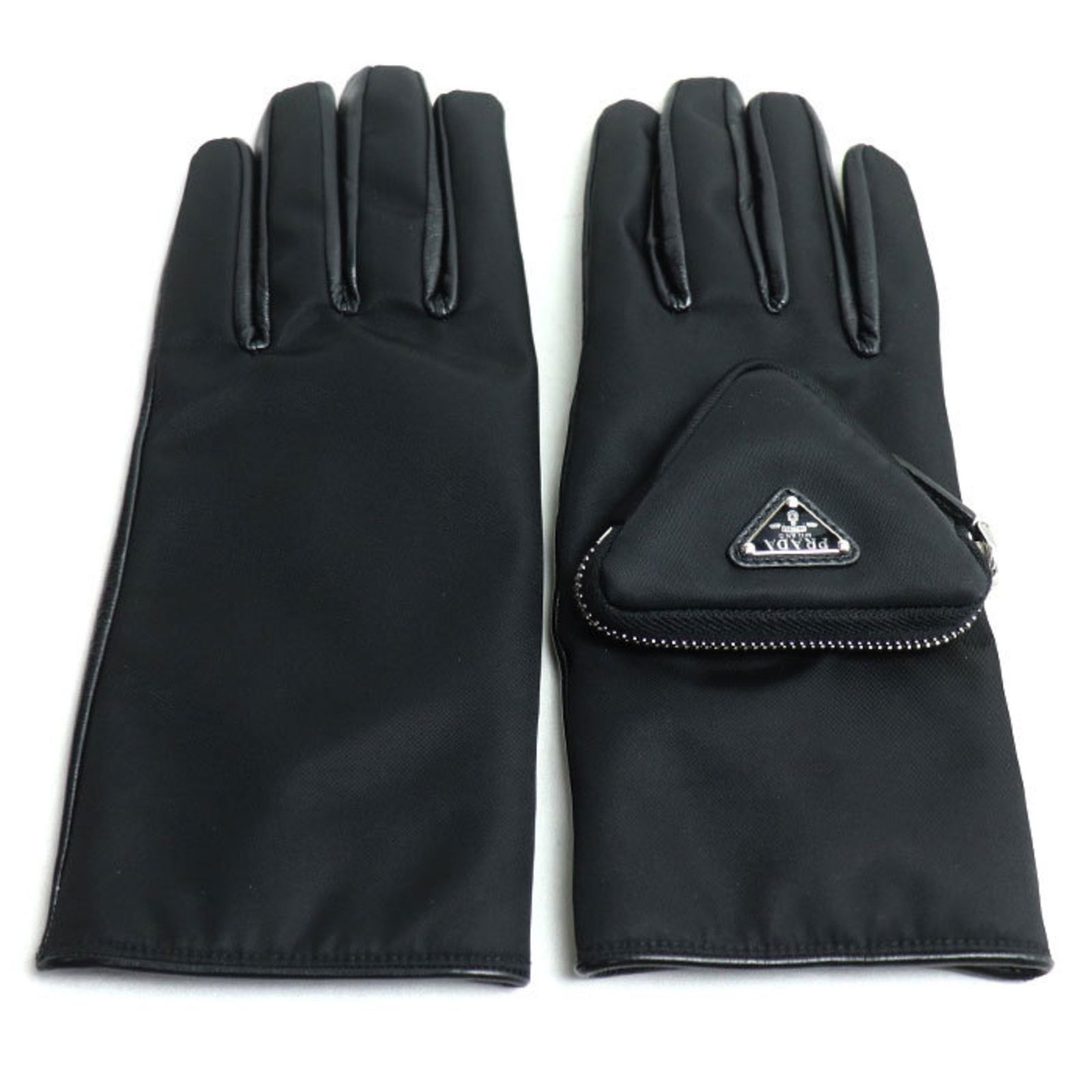 Black Leather Prada Triangle Logo Women's Bag from Italy: Black Leather Prada Triangle Logo Women's Bag from Italy This Prada Triangle Logo bag for women is crafted from black leather and features the iconic Prada triangle logo. Made in Italy, the bag measur