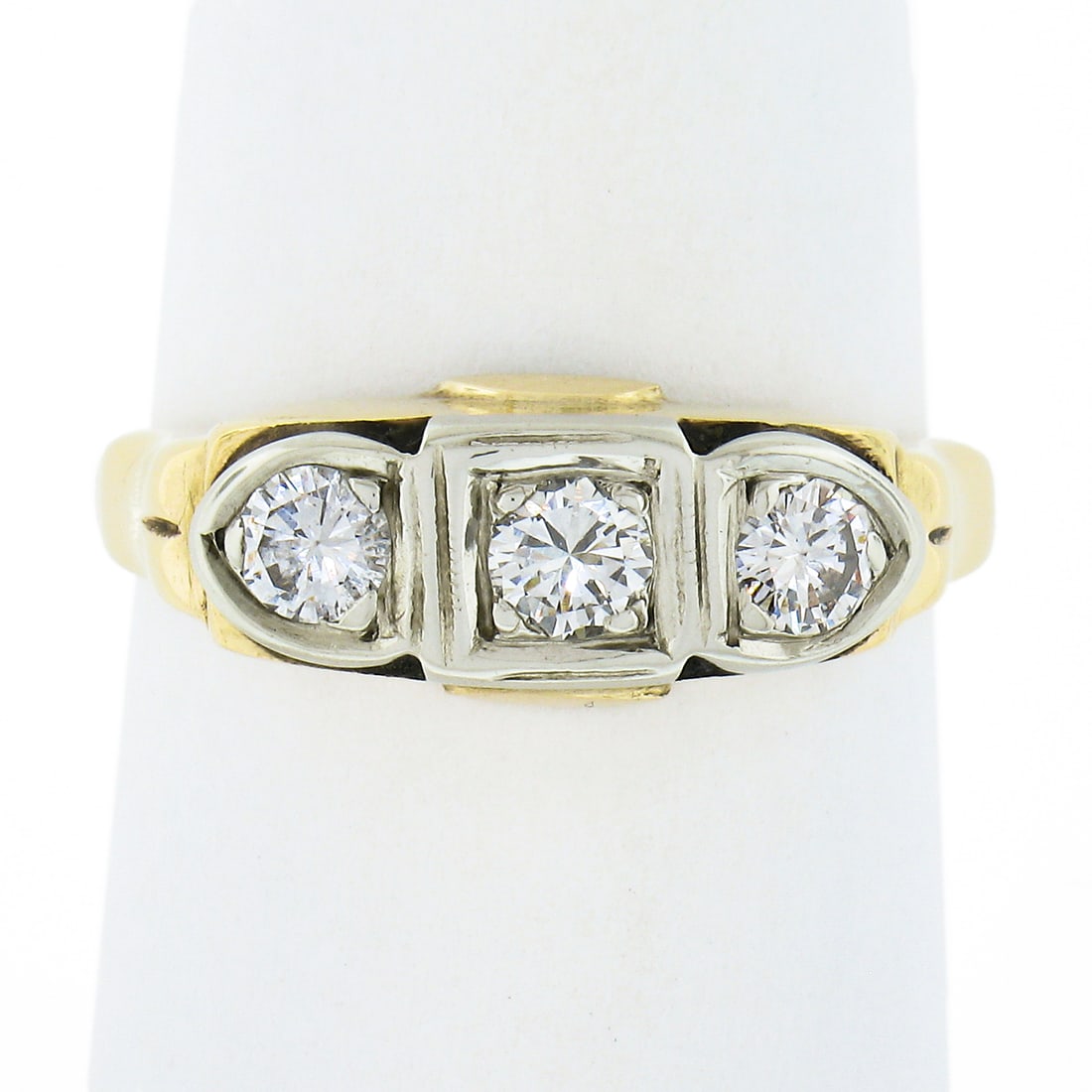 Vintage 14K Two Tone Gold 0.45ctw Diamond 3-Stone Band Ring: Vintage 14K Two Tone Gold 0.45ctw Diamond 3-Stone Band Ring This exquisite vintage ring features a polished band crafted from solid 14K two-tone gold, showcasing three round brilliant diamonds in a st
