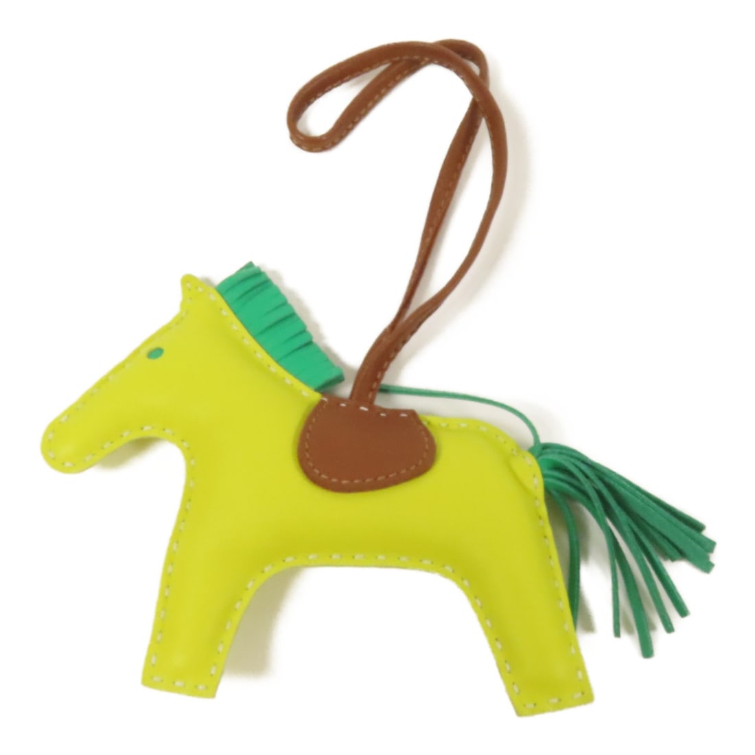HERMES Rodeo MM Charm in Lime Lambskin Leather: HERMES Rodeo MM Charm in Lime Lambskin Leather This HERMES Rodeo MM Charm is crafted from luxurious lambskin leather, showcasing a vibrant yellow color that adds a playful touch to your accessories. I