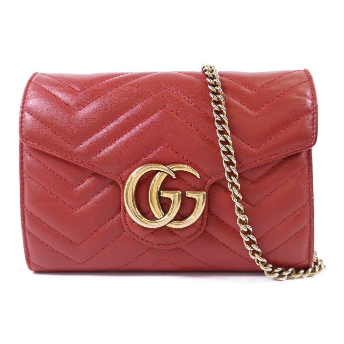 Red GG Marmont Small Chain Shoulder Bag by Gucci in Calfskin Leather: Red GG Marmont Small Chain Shoulder Bag by Gucci in Calfskin Leather This is a Gucci GG Marmont chain shoulder bag crafted from red calfskin leather. The bag features a gold tone chain shoulder strap