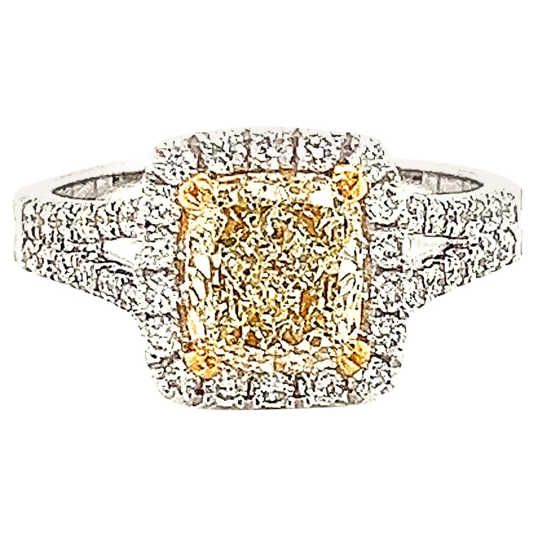 1.87ct Fancy Yellow VS1 Diamond Halo Ring 18k Gold: 1.87ct Fancy Yellow VS1 Diamond Halo Ring 18k Gold Elevate your style with this stunning 1.87ctt Fancy Yellow VS1 Radiant Diamond Halo Ring, crafted in luxurious 18k gold. This contemporary piece feat