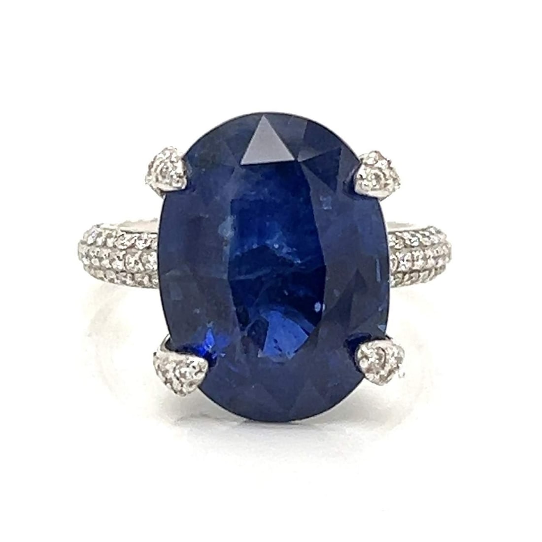 GIA Certified 12.30 Ct Ceylon Sapphire Diamond Ring in 18K White Gold: GIA Certified 12.30 Ct Ceylon Sapphire Diamond Ring in 18K White Gold This exquisite 18K white gold ring showcases a stunning GIA Certified Ceylon sapphire weighing 12.30 Ct., surrounded by approximat