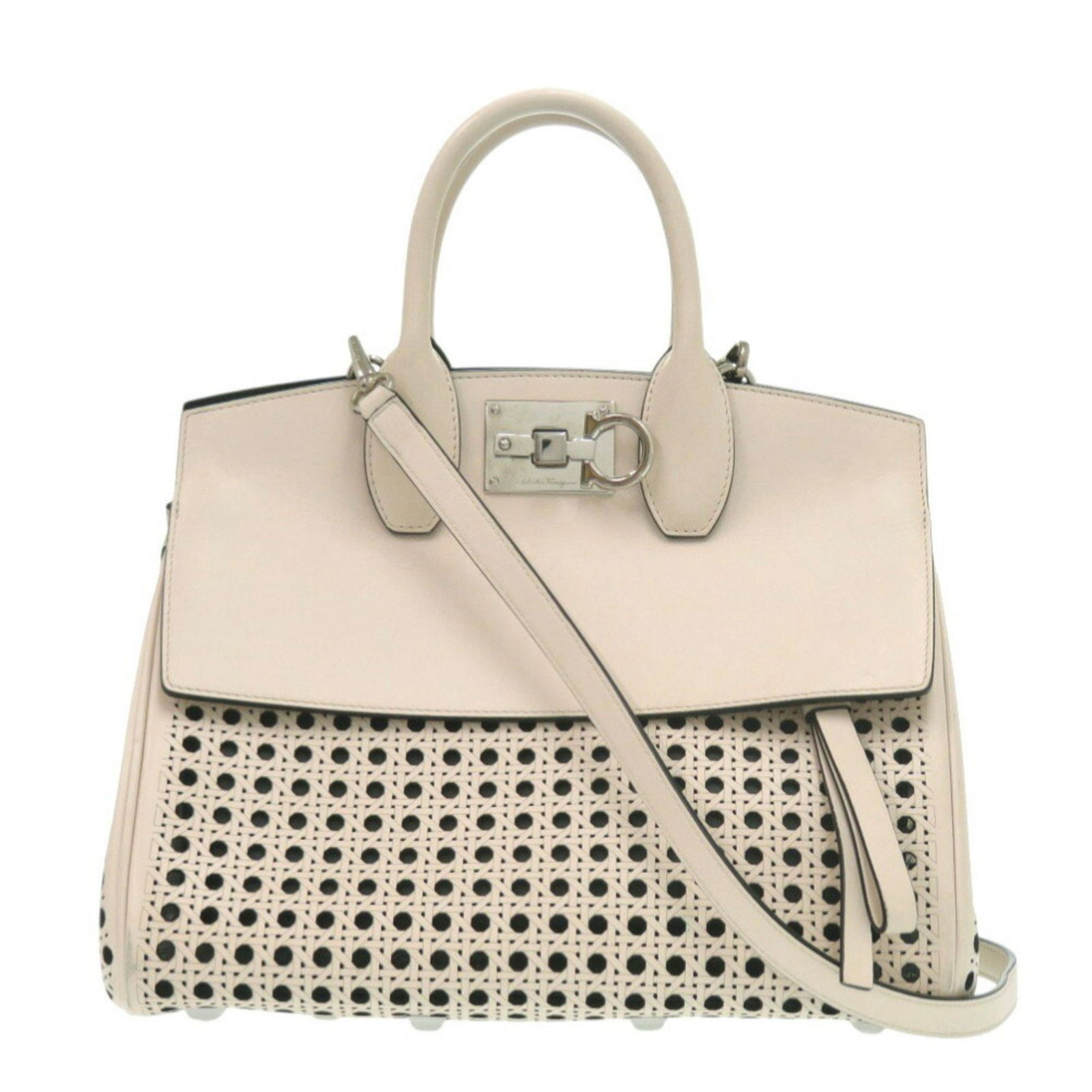 Beige Leather Studio Handbag by Salvatore Ferragamo: Beige Leather Studio Handbag by Salvatore Ferragamo This Salvatore Ferragamo Studio handbag features a beige leather exterior and is designed for women. The bag is crafted in Italy and offers a spacio