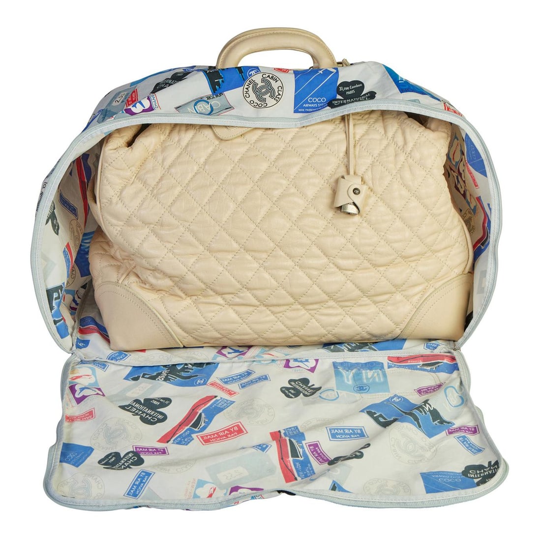 Chanel 2006 Paris New York Cream Weekender Bag with Hologram and Keys: Chanel 2006 Paris New York Cream Weekender Bag with Hologram and Keys Discover the elegance of the Chanel Paris New York Cream Traveler Weekender Bag, a standout piece from the 2006 Collection. This a