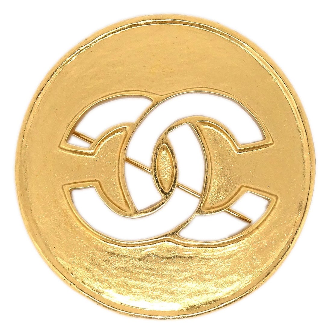 Gold Tone Medallion Brooch by Chanel 98A Collection: Gold Tone Medallion Brooch by Chanel 98A Collection This Chanel medallion brooch pin features a gold-tone finish and classic medallion motif. Crafted in France, it offers a signature touch of elegance