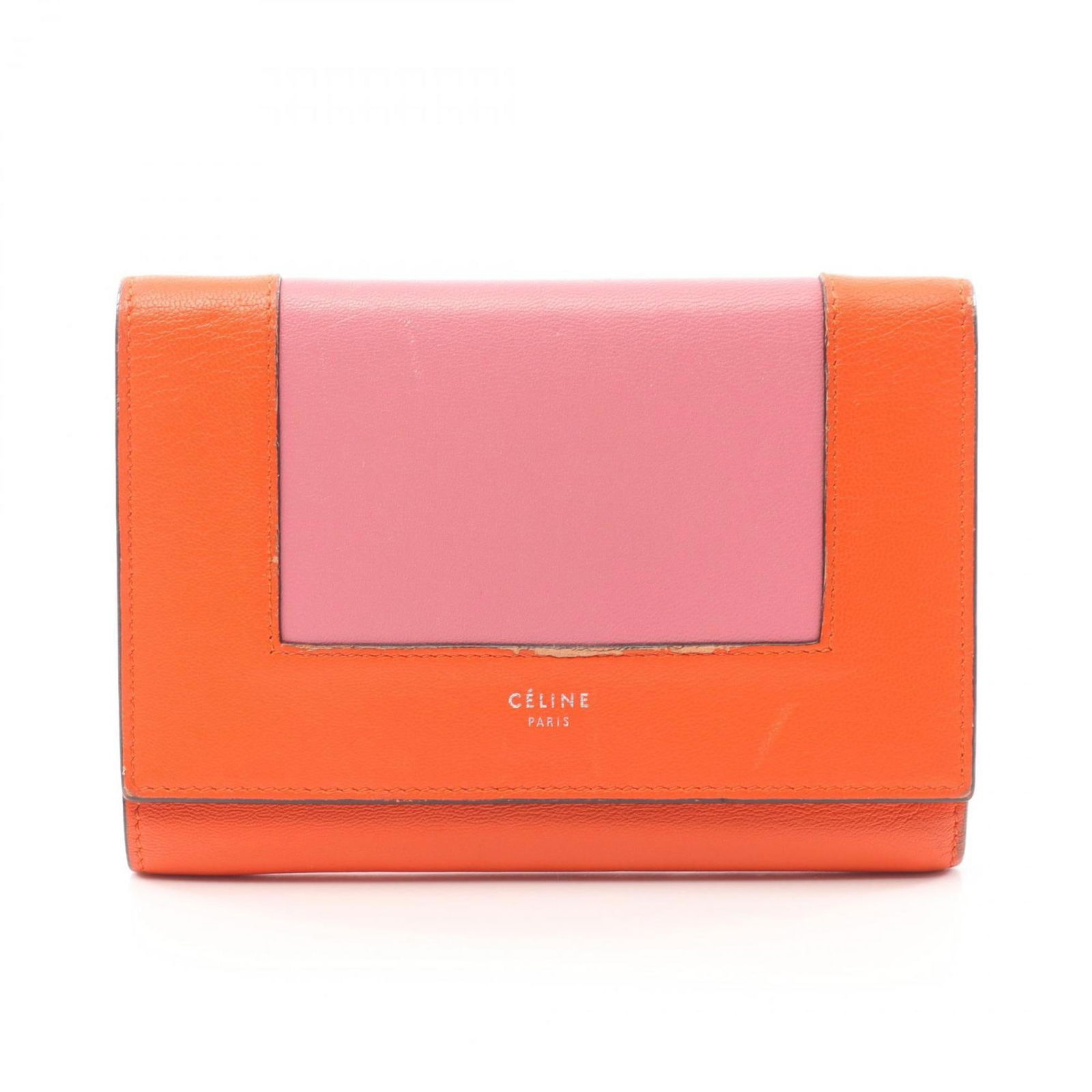 Orange Leather Tri-Fold Wallet by Celine France: Orange Leather Tri-Fold Wallet by Celine France This Celine Tri-Fold is a versatile unisex accessory crafted from orange leather. Designed in France, it features a compact silhouette. Please note the