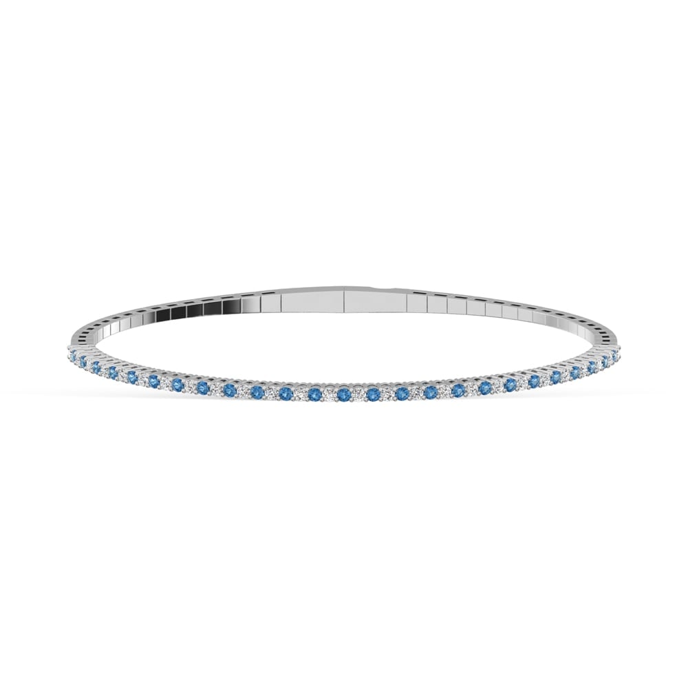 14K White Gold 1 Ct.Tw. Alternate Blue and White Lab Grown Diamond Flexi Bangle: 14K White Gold 1 Ct.Tw. Alternate Blue and White Lab Grown Diamond Flexi Bangle Crafted in 14K White Gold, this flexi bangle alternates blue and white lab grown diamonds totaling 1 Ct.Tw., offering re