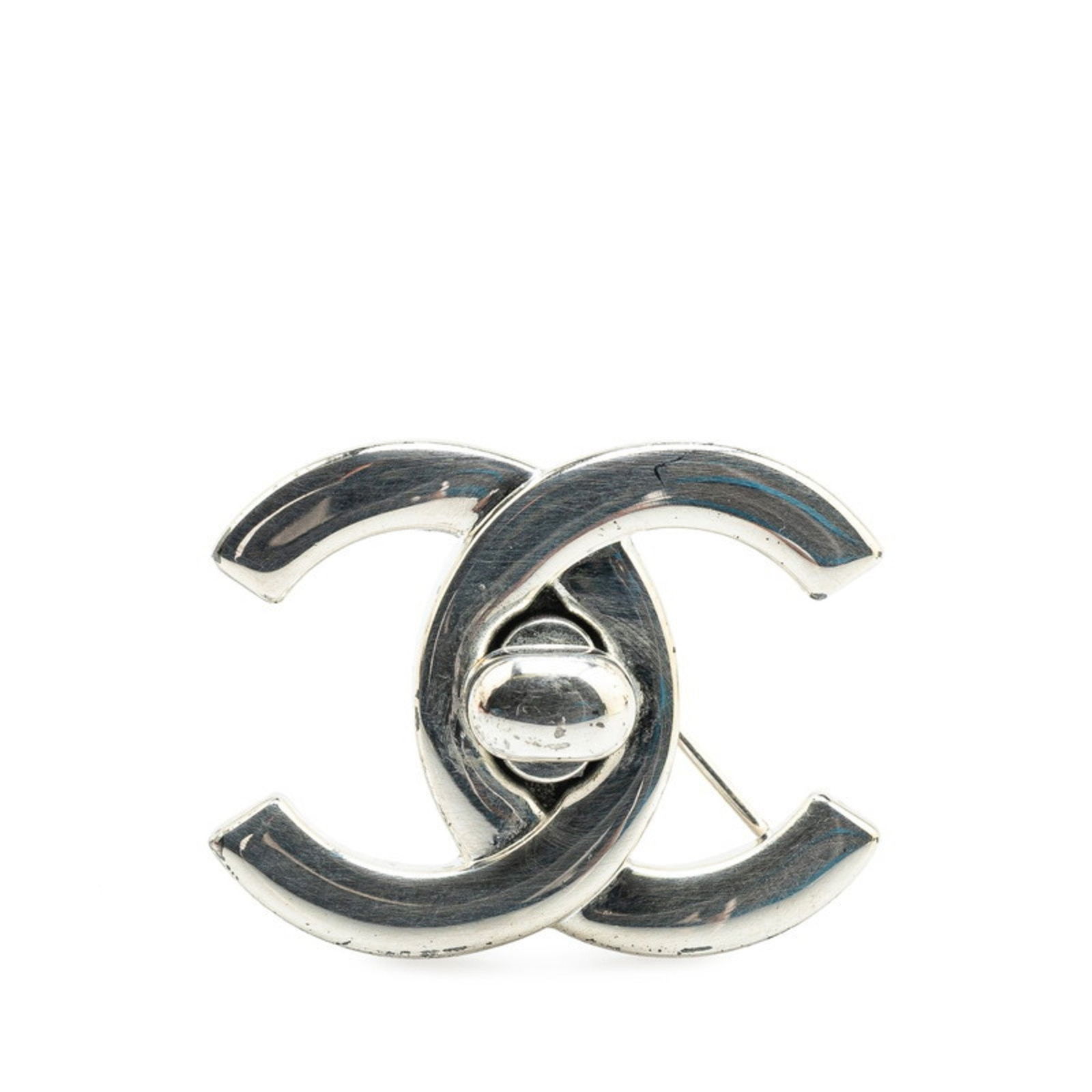 Chanel Coco Mark Silver Tone Metal Pin Brooch: Chanel Coco Mark Silver Tone Metal Pin Brooch This Chanel Coco Mark accessory features a sleek silver tone and is crafted from metal. Designed for women, it showcases the iconic Coco Mark motif. The p