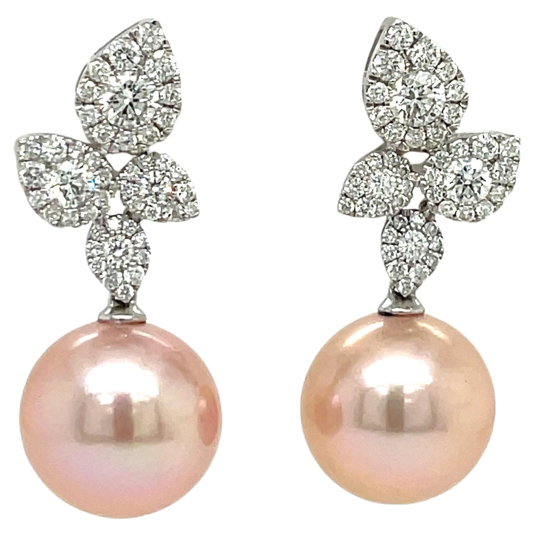 Contemporary 18KT White Gold Pink Freshwater Pearl Diamond Earrings: Contemporary 18KT White Gold Pink Freshwater Pearl Diamond Earrings Elevate your elegance with these stunning Pink Freshwater Pearl Diamond Cluster Leaf Earrings. Crafted from 18k White Gold, these co