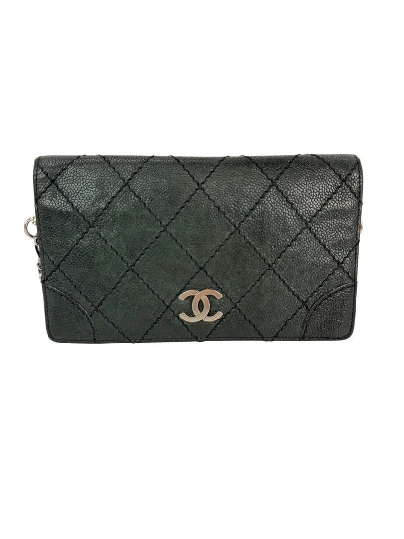 Chanel Vintage Bifold Black Caviar Leather Wallet: Chanel Vintage Bifold Black Caviar Leather Wallet This Chanel Vintage Wild Stitch Wallet is a stylish accessory crafted from luxurious black caviar leather. It features a classic quilted pattern and a