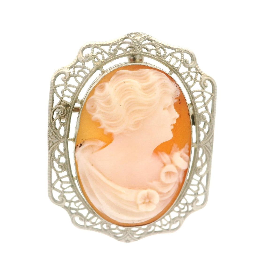 Vintage 14k White Gold Cameo Shell Filigree Brooch Pendant: Vintage 14k White Gold Cameo Shell Filigree Brooch Pendant This exquisite vintage 14k white gold pin brooch pendant features a beautifully carved cameo shell. The oval-cut shell showcases a salmon bas