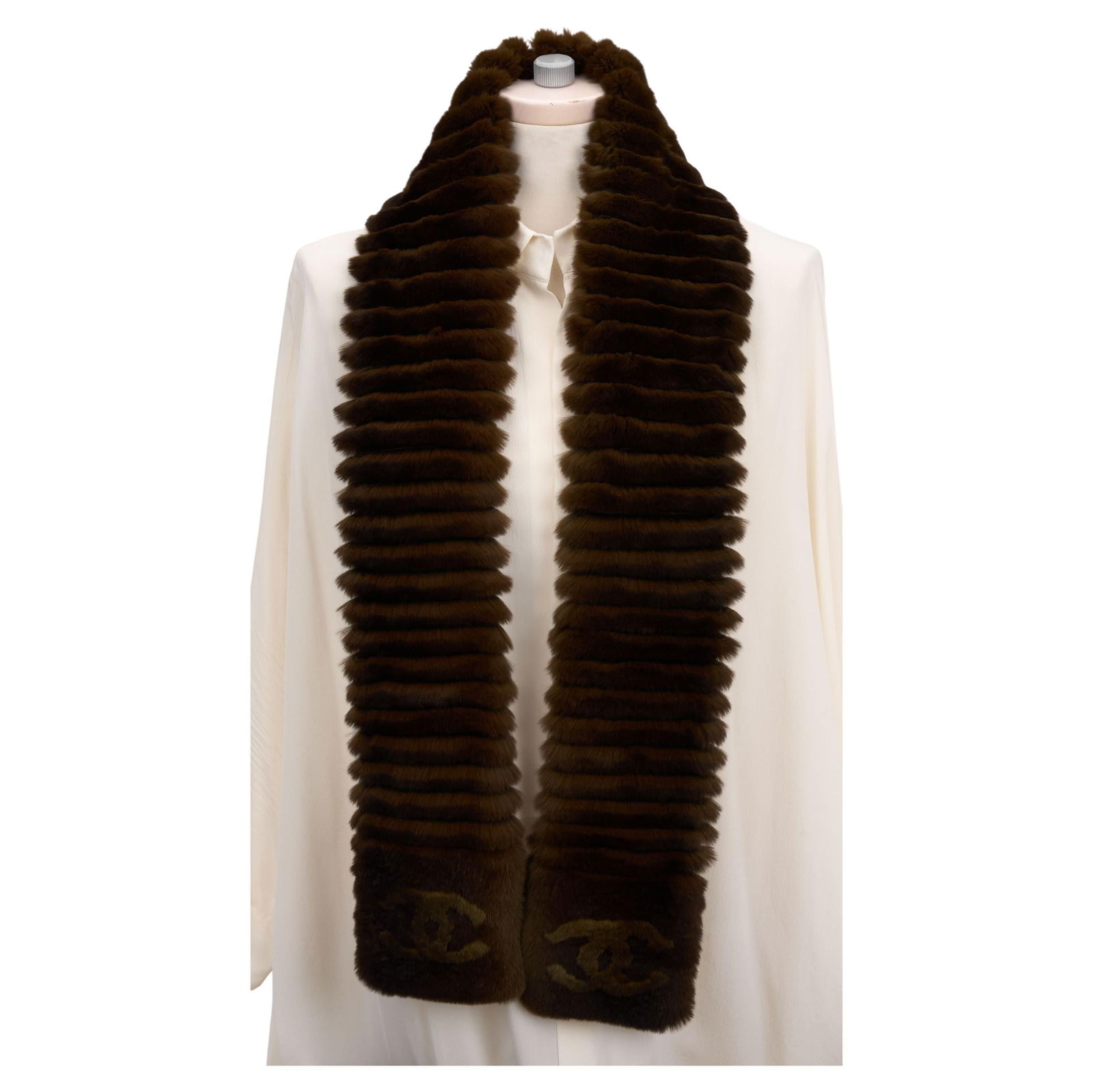 Chanel Orylag and Cashmere Logo Scarf in Brown: Chanel Orylag and Cashmere Logo Scarf in Brown Elevate your accessory collection with this exquisite Chanel Cincilla Orylag Fur CC Scarf. Crafted from a luxurious blend of 70% Cincilla Orylag and 30%