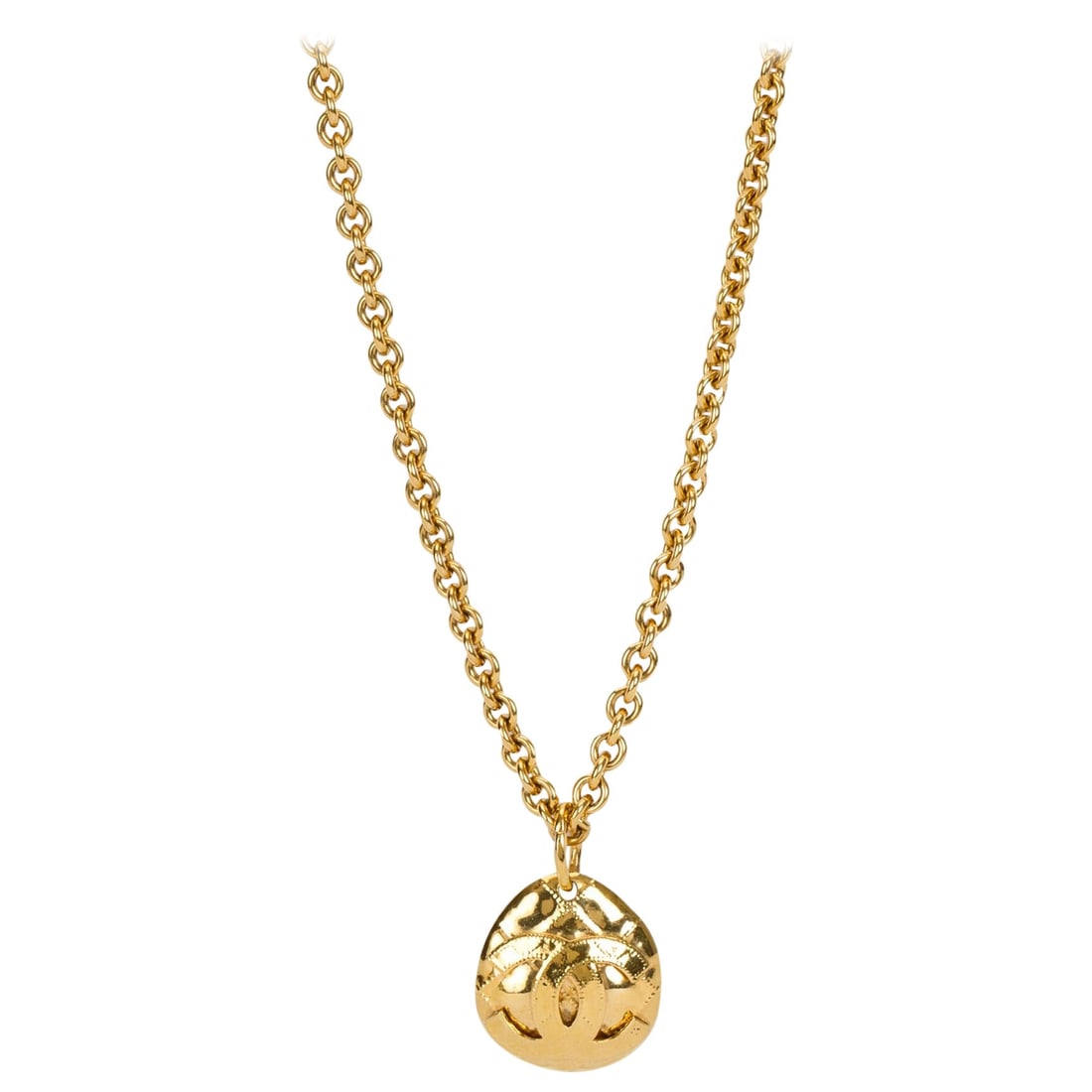 Chanel 1994 Vintage Quilted Gold CC Pendant Necklace: Chanel 1994 Vintage Quilted Gold CC Pendant Necklace This exquisite vintage Chanel necklace from the Spring '94 collection features a long quilted pendant adorned with the iconic gold CC logo. With th