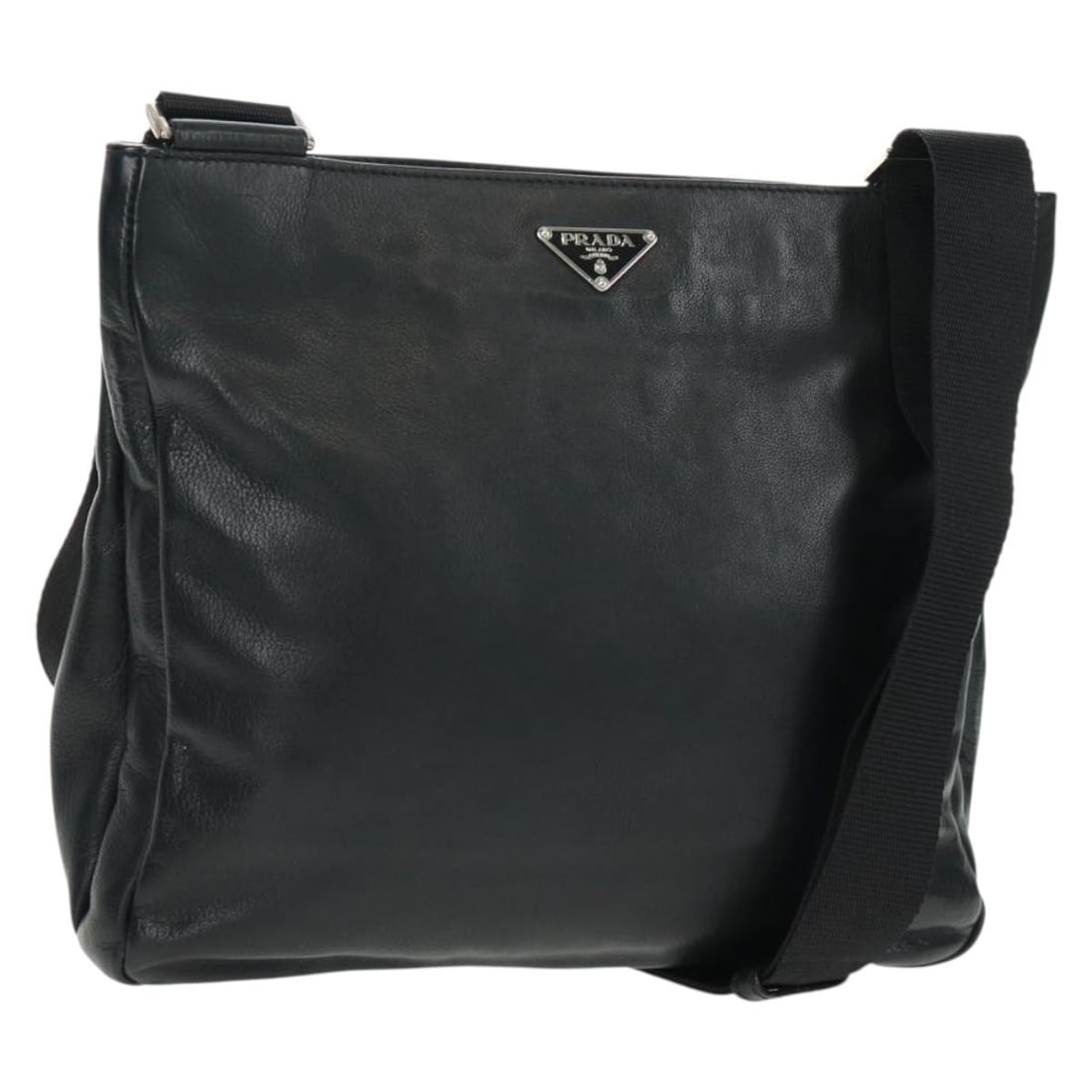 Prada Black Leather Shoulder Bag with Silver Tone Accents and Dust Bag: Prada Black Leather Shoulder Bag with Silver Tone Accents and Dust Bag This Prada shoulder bag features luxurious black leather with silver-tone accents. Designed with a sleek silhouette, it offers an