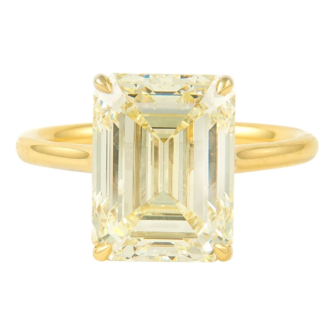 6.02 Carat Emerald Cut Diamond Solitaire Ring 18k Yellow Gold HRD Certified: 6.02 Carat Emerald Cut Diamond Solitaire Ring 18k Yellow Gold HRD Certified This stunning modern diamond solitaire ring showcases a remarkable 6.02 carat emerald cut diamond, graded by HRD with an M c