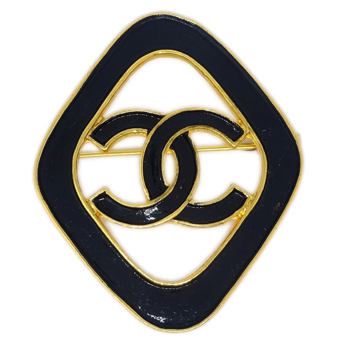 Chanel Black Rhombus Brooch Pin Gold-Plated 93C: Chanel Black Rhombus Brooch Pin Gold-Plated 93C This exquisite Chanel Rhombus Brooch Pin combines timeless elegance with modern flair. Crafted in France, this stunning piece features a sleek black des