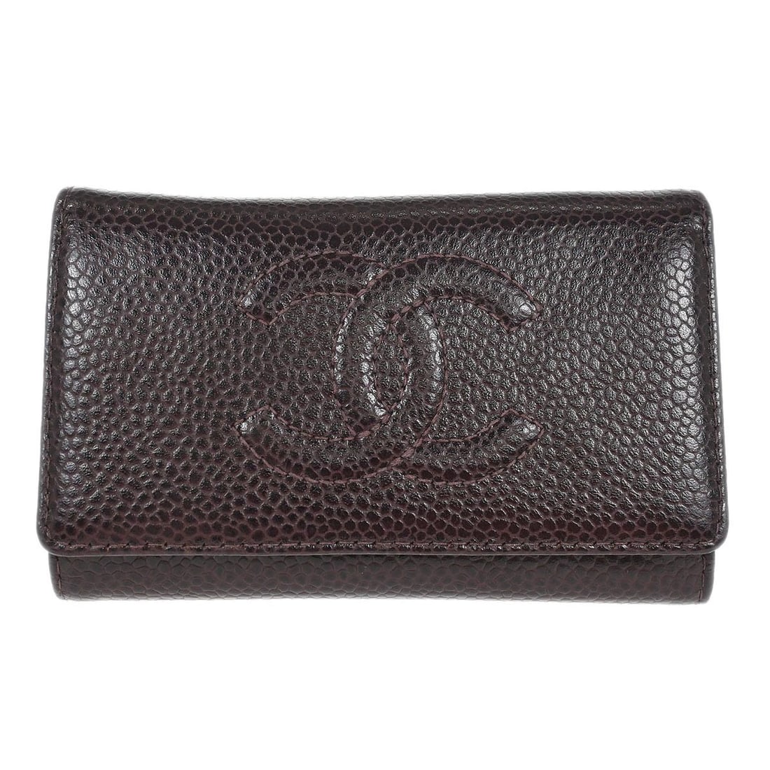 Brown Calfskin Leather Key Holder by Chanel Italy: Brown Calfskin Leather Key Holder by Chanel Italy This Chanel key case is crafted from brown leather and features a button logo accent. It is a vintage piece made in Italy. The condition is rated very