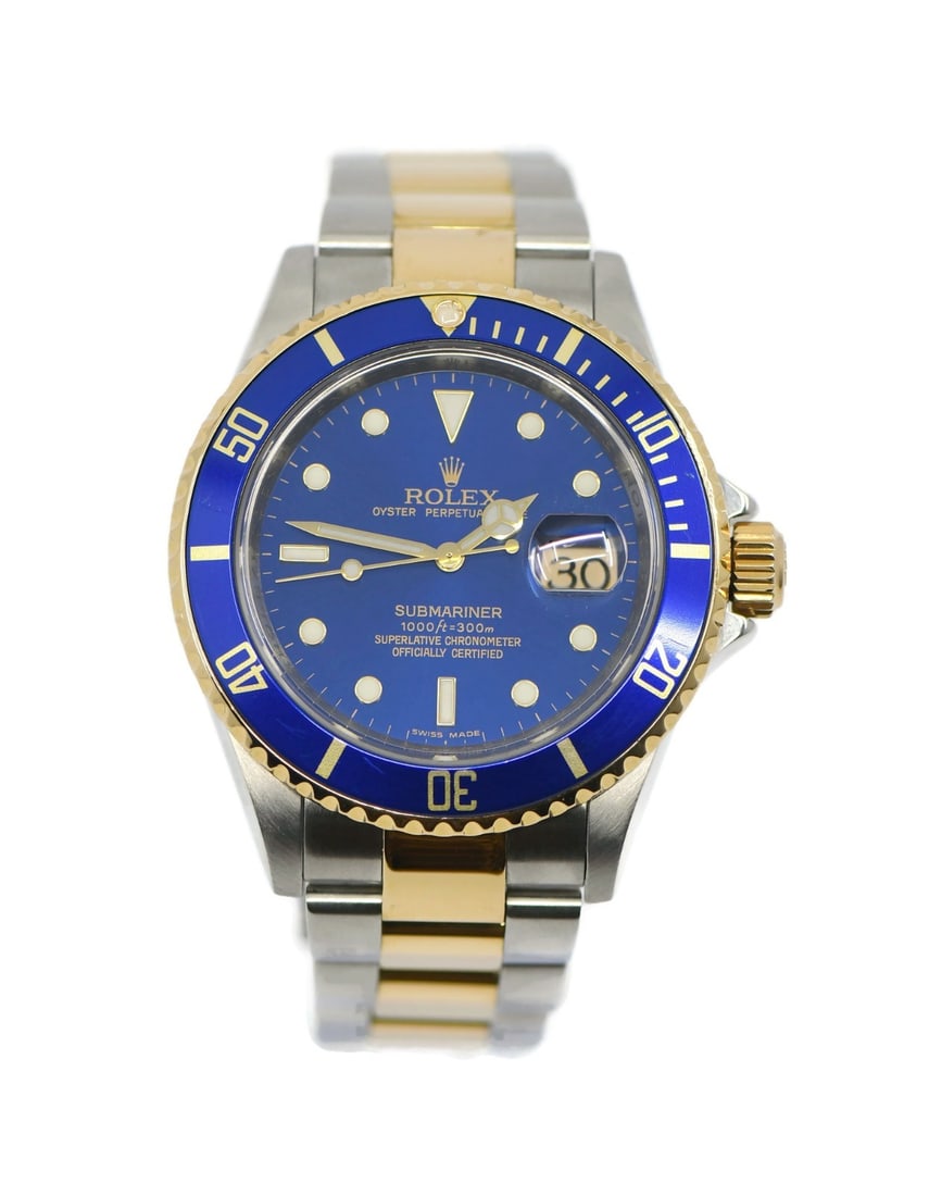 Rolex Submariner 18K Stainless Steel Watch 16613 with Box and Papers: Rolex Submariner 18K Stainless Steel Watch 16613 with Box and Papers Presenting the Rolex Submariner, a stunning wristwatch that combines luxury and functionality. Crafted in 18K gold and stainless st