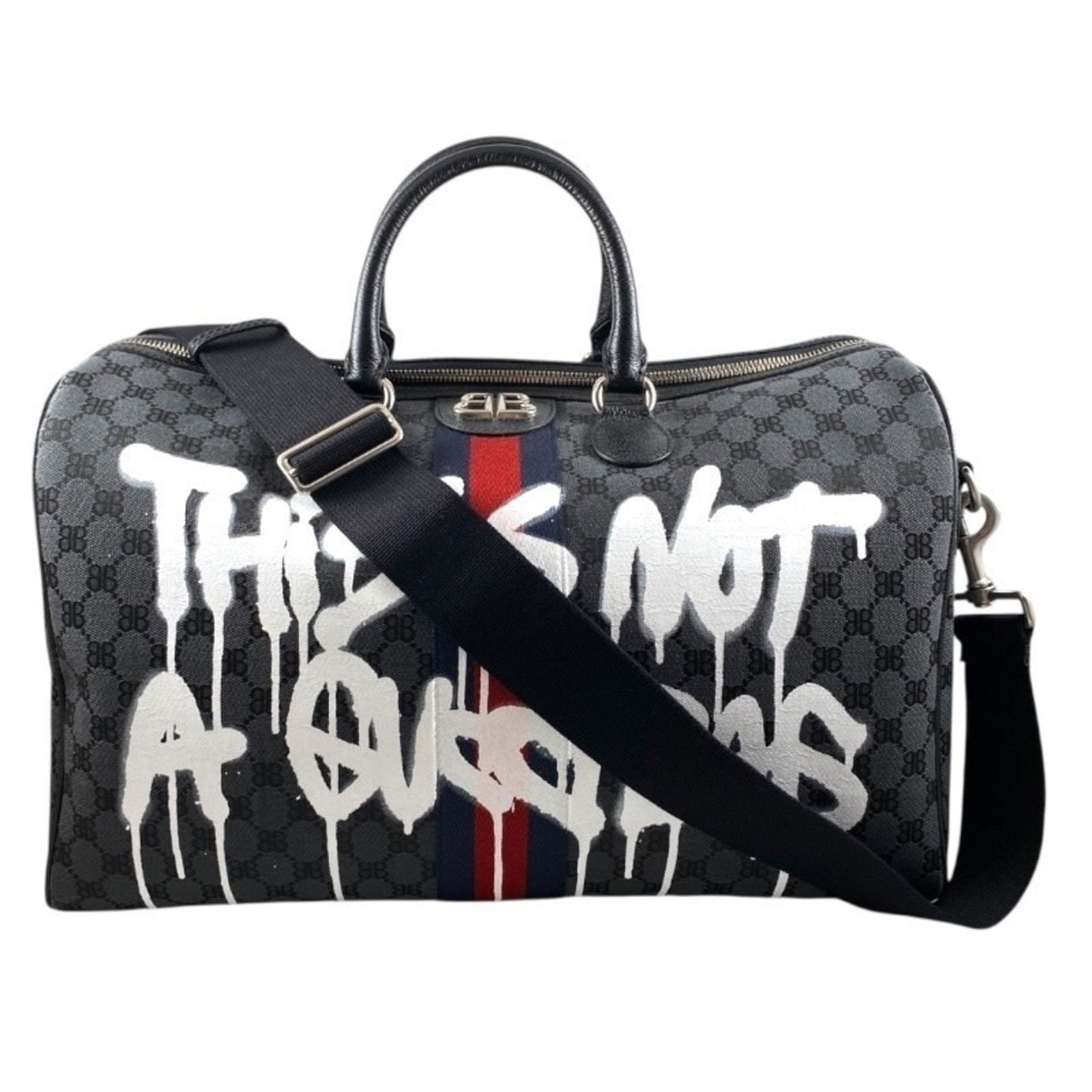 Balenciaga Black Canvas Leather Bag with 25cm x 43cm x 23cm Dimensions: Balenciaga Black Canvas Leather Bag with 25cm x 43cm x 23cm Dimensions This Balenciaga bag features a versatile unisex design crafted from a combination of canvas and leather in black. The bag offers