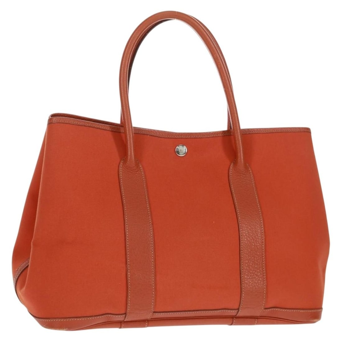Hermes Garden Party PM Orange Coated Canvas Tote with Dust Bag and Box: Hermes Garden Party PM Orange Coated Canvas Tote with Dust Bag and Box This Hermes Garden Party PM handbag features an elegant orange and silver design crafted from coated canvas. The bag includes a s