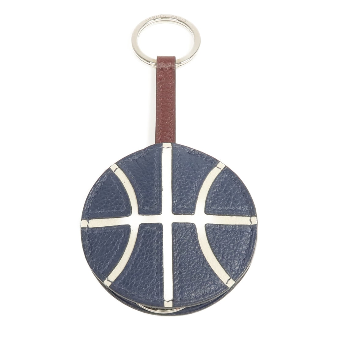 Evercolor Navy Calfskin Key Ring with Palladium Hardware: Evercolor Navy Calfskin Key Ring with Palladium Hardware This key ring features Evercolor calfskin leather in a navy hue and is finished with palladium hardware. Crafted in France, it offers both eleg