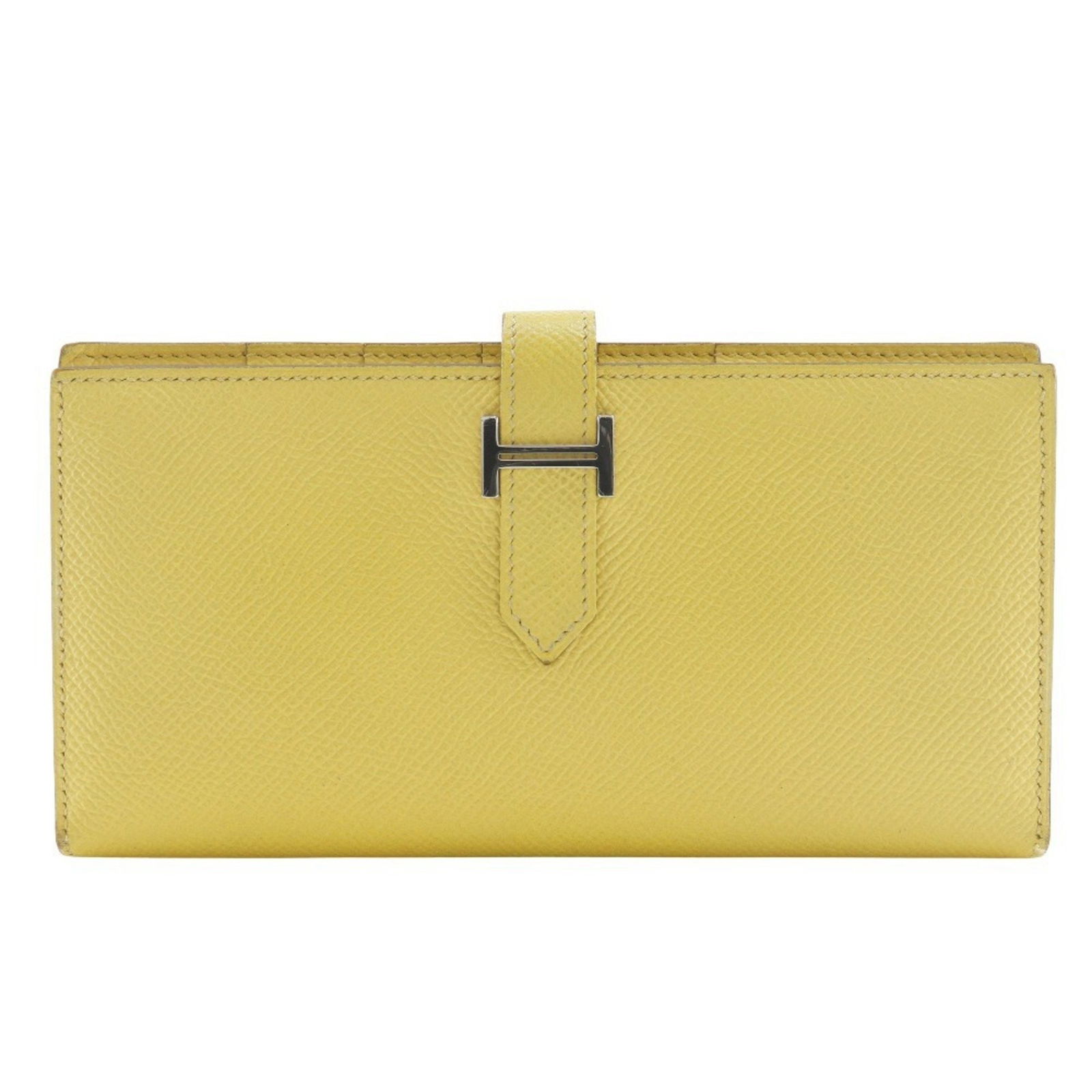 Yellow Leather Bearn Wallet by Hermes France: Yellow Leather Bearn Wallet by Hermes France This Hermes Bearn wallet features a vibrant yellow leather exterior with a sleek, structured design. The wallet is crafted for women and offers practical s