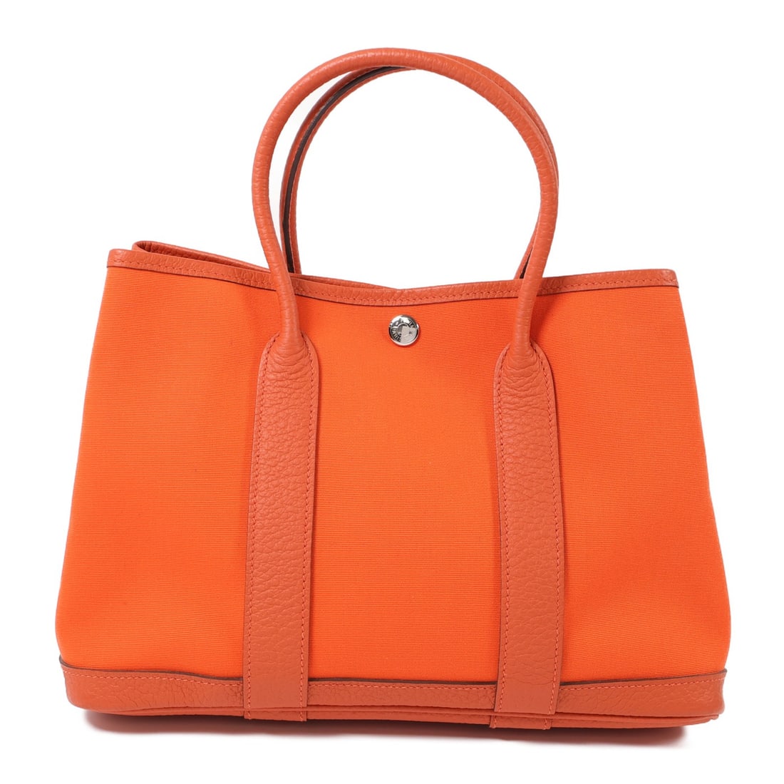 HERMES Garden Party TPM Tote Bag Canvas Orange PHW: HERMES Garden Party TPM Tote Bag Canvas Orange PHW Introducing the HERMES Garden Party TPM Tote Bag, a stunning accessory crafted from high-quality canvas in a vibrant orange hue. This tote bag featur