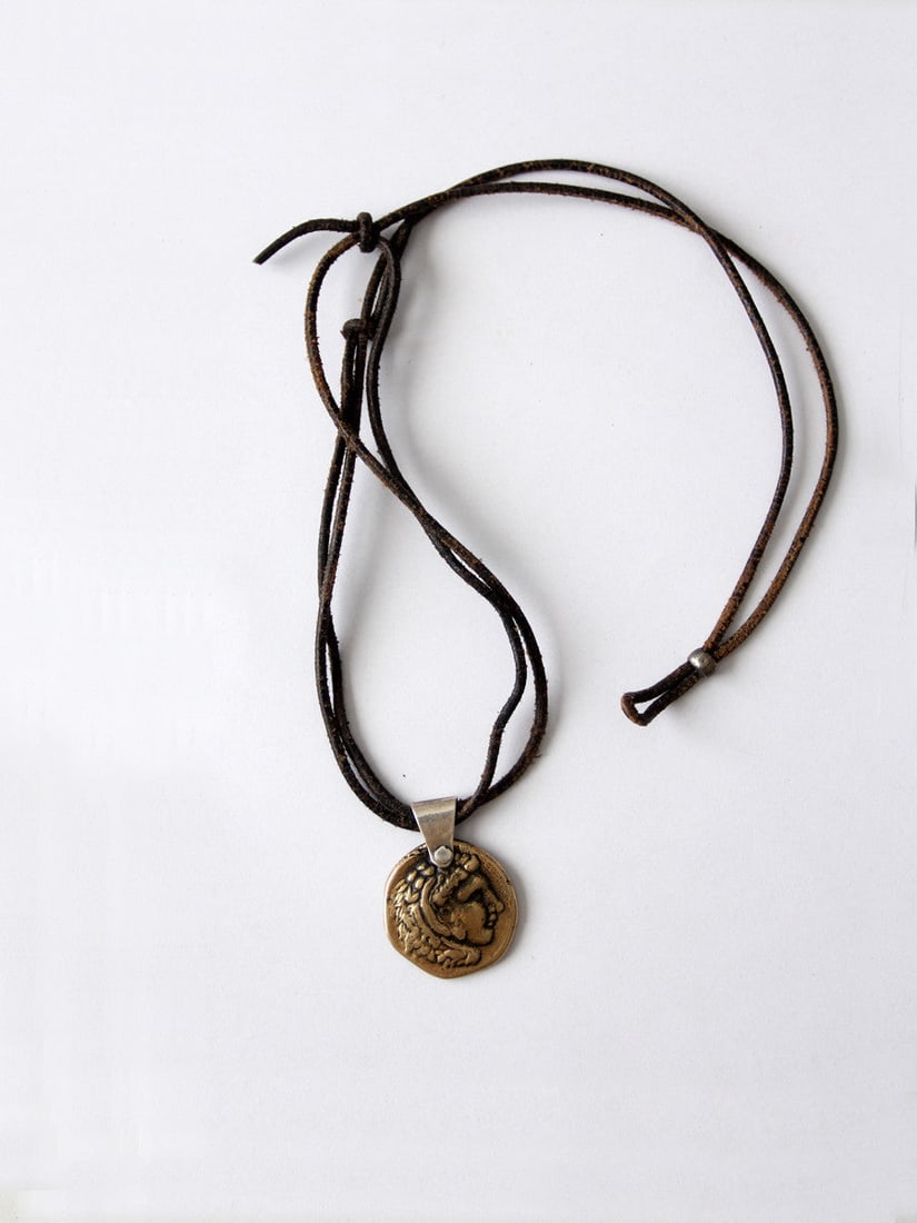 Vintage Alexander the Great Coin Pendant Necklace: Vintage Alexander the Great Coin Pendant Necklace Discover a unique piece from our Stylist's Collection: a vintage necklace featuring an ancient coin of Alexander the Great. The coin has been elegantl
