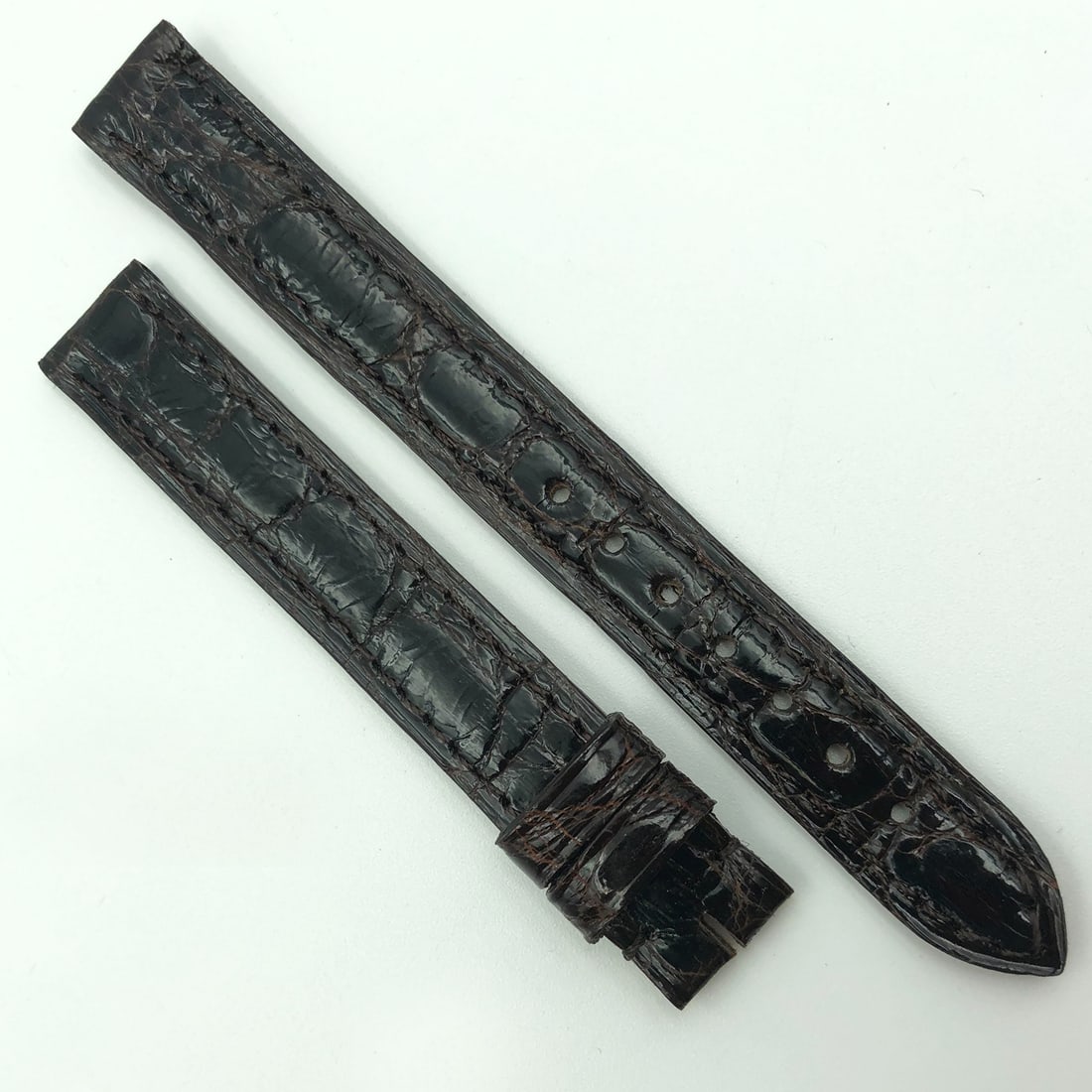 Cartier Dark Brown Leather Strap 5801A03OCCA 12mm Authentic Band: Cartier Dark Brown Leather Strap 5801A03OCCA 12mm Authentic Band Enhance your timepiece with this authentic Cartier dark brown leather strap, model 5801A03OCCA. Designed specifically for comfort and s