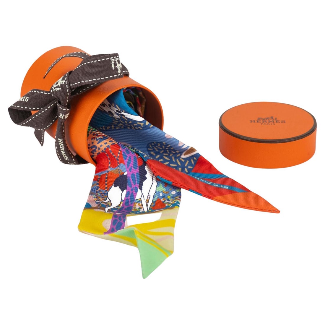 Hermes En Liberte Silk Twilly 2x34 Inches New with Box: Hermes En Liberte Silk Twilly 2x34 Inches New with Box Elevate your style with the Hermes "En Liberte'" Silk Twilly, a versatile accessory crafted from luxurious silk. Measuring 2 inches in height and