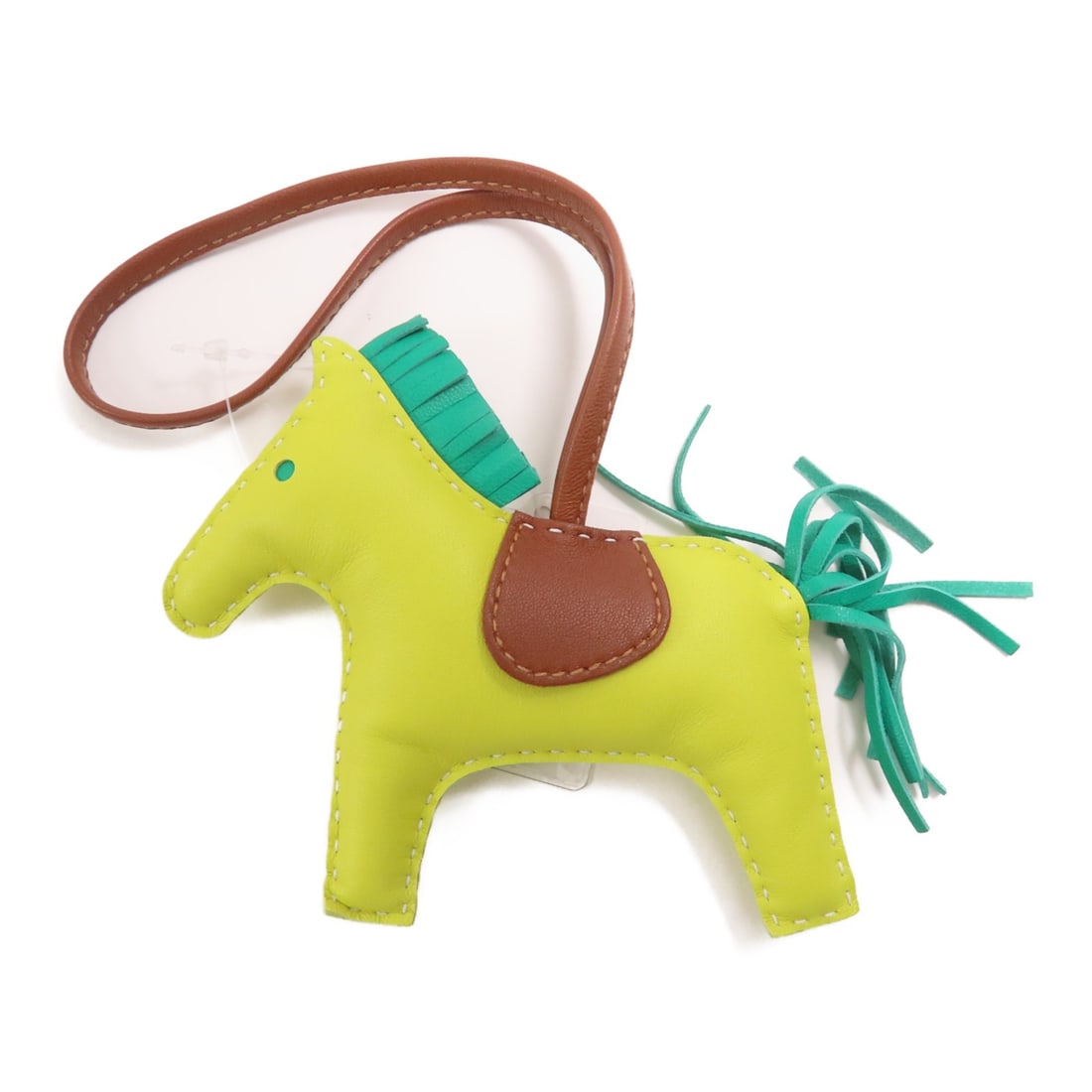 HERMES Rodeo MM Yellow Lambskin Leather Charm France: HERMES Rodeo MM Yellow Lambskin Leather Charm France Introducing the HERMES Rodeo MM Charm crafted from premium lambskin leather in a vibrant yellow hue. This stylish charm is perfect for adding a tou