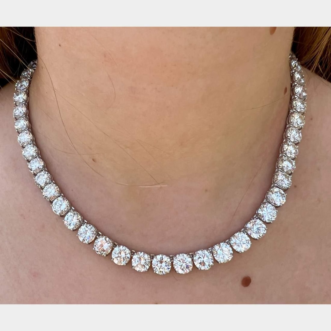 Platinum Diamond Necklace 70.00 Ct 56 Diamonds G-H VS1-SI1: Platinum Diamond Necklace 70.00 Ct 56 Diamonds G-H VS1-SI1 This stunning platinum necklace features an impressive total diamond weight of approximately 70.00 Ct. The necklace is elegantly set with 56