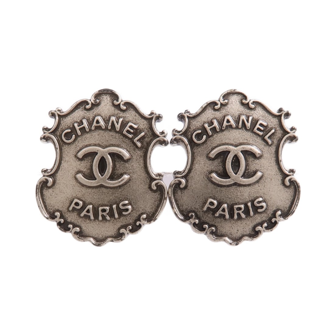 Silver Tone Pierced Earrings by CHANEL with CC Logo: Silver Tone Pierced Earrings by CHANEL with CC Logo These CHANEL CC pierced earrings feature a silver-tone metal design, offering a stylish and sophisticated accessory. Made in France, the earrings di