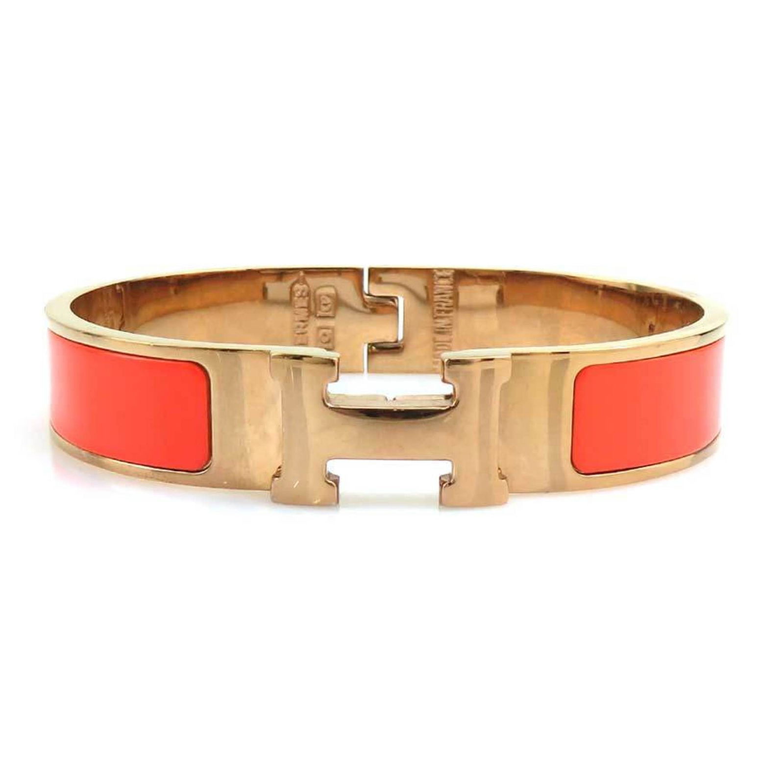 Orange Metal Clic H 16cm Bracelet by Hermes for Women: Orange Metal Clic H 16cm Bracelet by Hermes for Women This Hermes Clic H bracelet features a vibrant orange color and is crafted from metal. Designed for women, it offers a sleek and stylish accessory