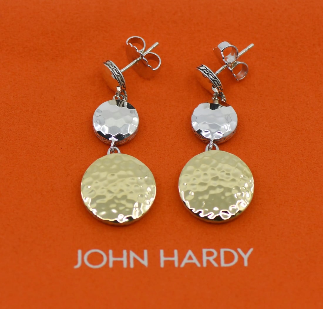 Sterling Silver and 18K Gold Dangle Earrings by John Hardy: Sterling Silver and 18K Gold Dangle Earrings by John Hardy These John Hardy earrings feature a dangle/drop style crafted from sterling silver with 18K gold accents. They are designed without a main st