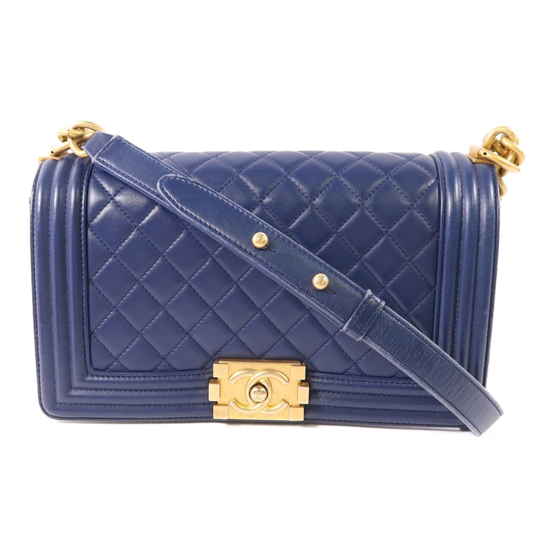CHANEL Boy Shoulder Bag Navy Lambskin Leather Chain Strap: CHANEL Boy Shoulder Bag Navy Lambskin Leather Chain Strap Introducing the exquisite CHANEL Boy Shoulder Bag, crafted from luxurious navy lambskin leather. This stylish accessory features a classic sho