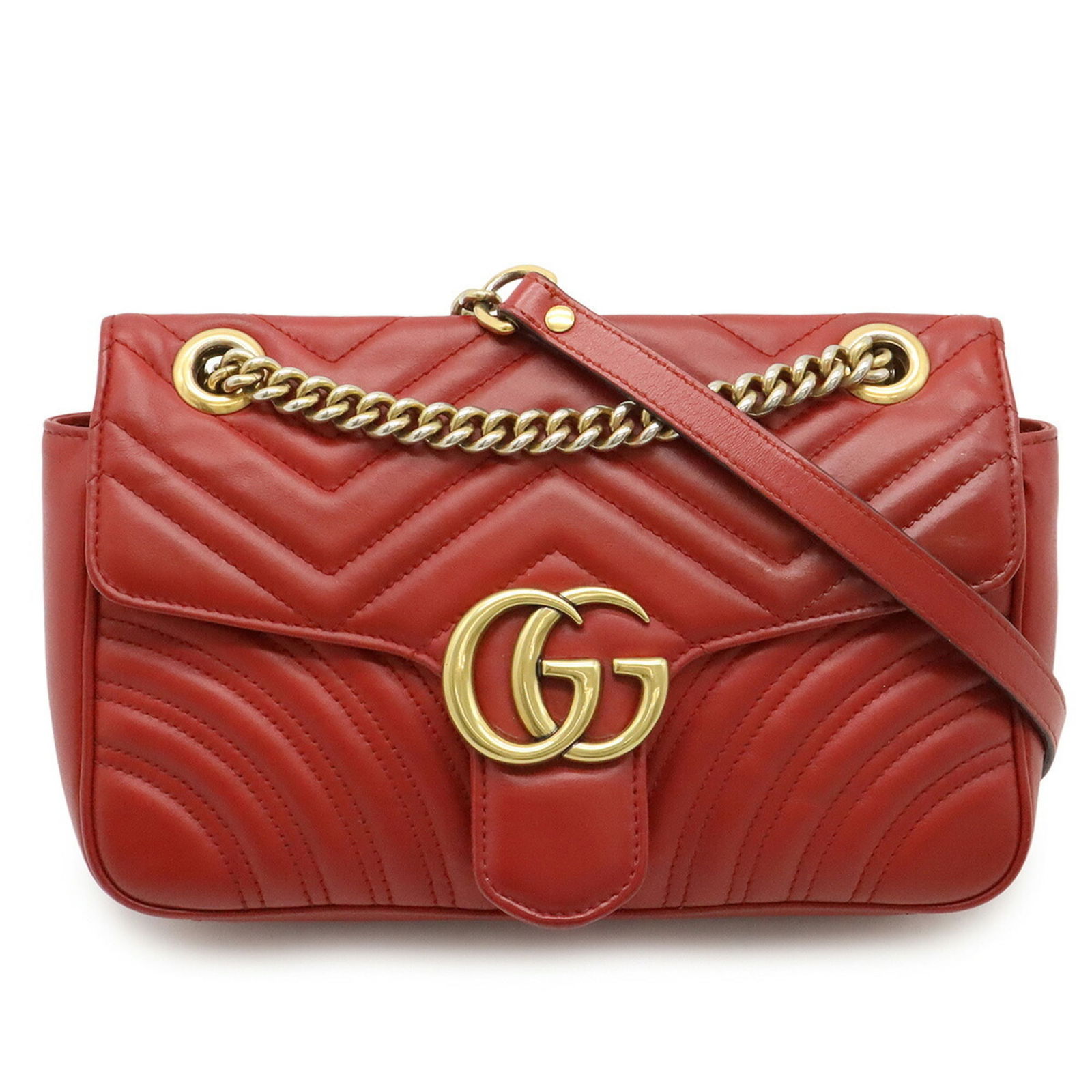 Red Leather Gucci Marmont Handbag 25 cm Italy: Red Leather Gucci Marmont Handbag 25 cm Italy This Gucci Marmont bag is crafted from red leather and features a feminine design. Made in Italy, it is sized at 25 cm wide, 16 cm high, and 7 cm deep. Th