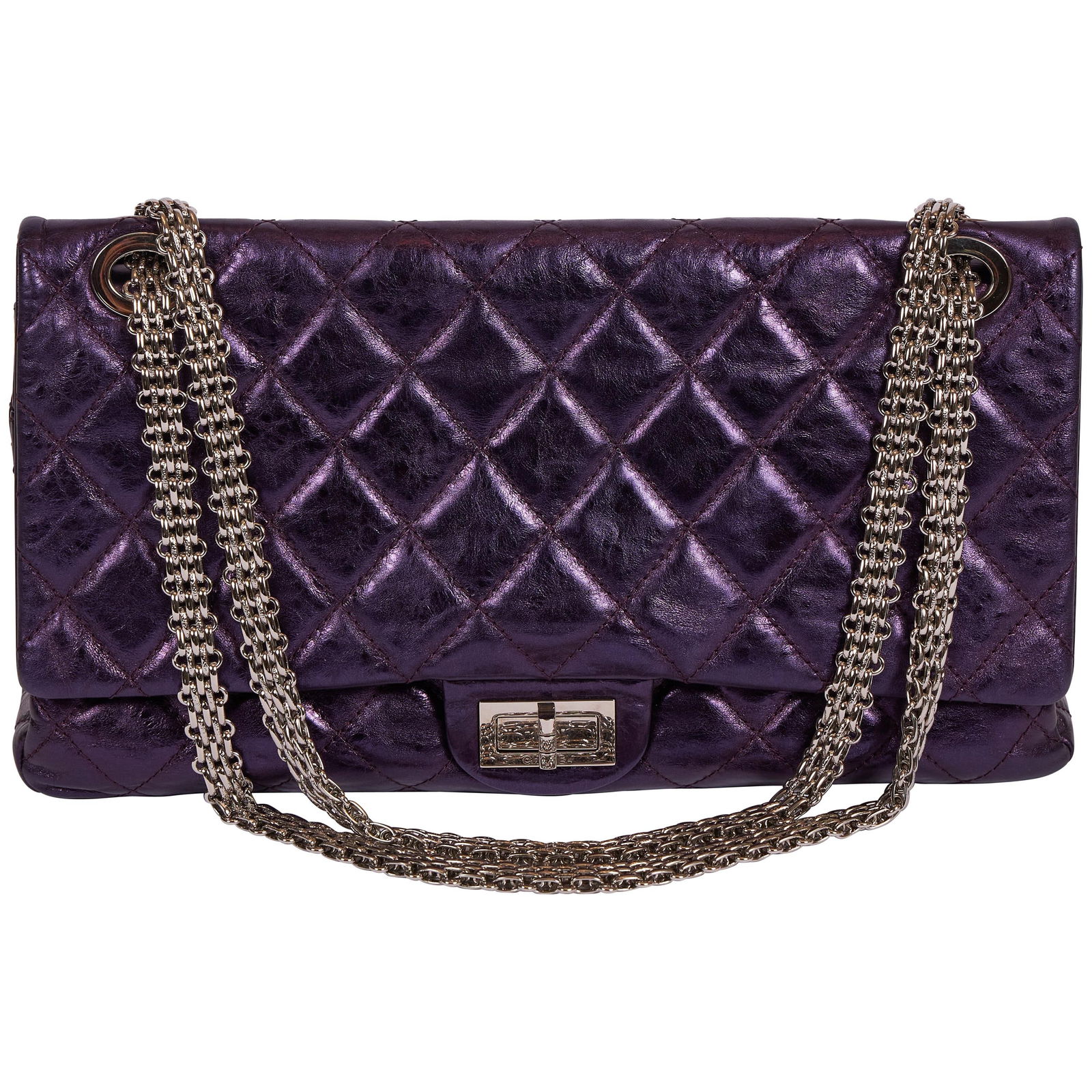 Chanel Purple Metallic Double Flap Maxi Reissue Bag Limited Edition: Chanel Purple Metallic Double Flap Maxi Reissue Bag Limited Edition Elevate your accessory collection with this stunning Chanel Purple Metallic Maxi Reissue Flap Bag. This limited edition piece featur