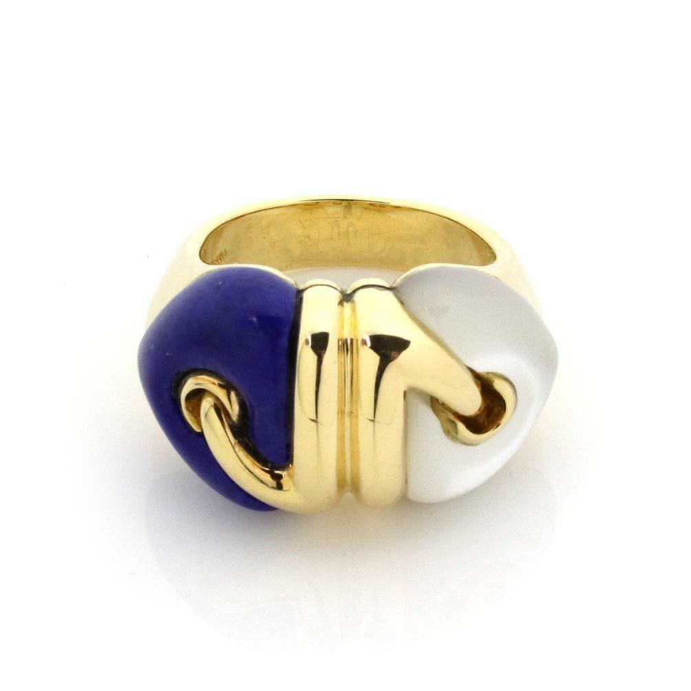 Bvlgari 18k Yellow Gold Double Heart Ring with Mother of Pearl and Lapis Lazuli: Bvlgari 18k Yellow Gold Double Heart Ring with Mother of Pearl and Lapis Lazuli This exquisite ring from Bvlgari showcases a unique design featuring two hearts: one crafted from Mother of Pearl and th