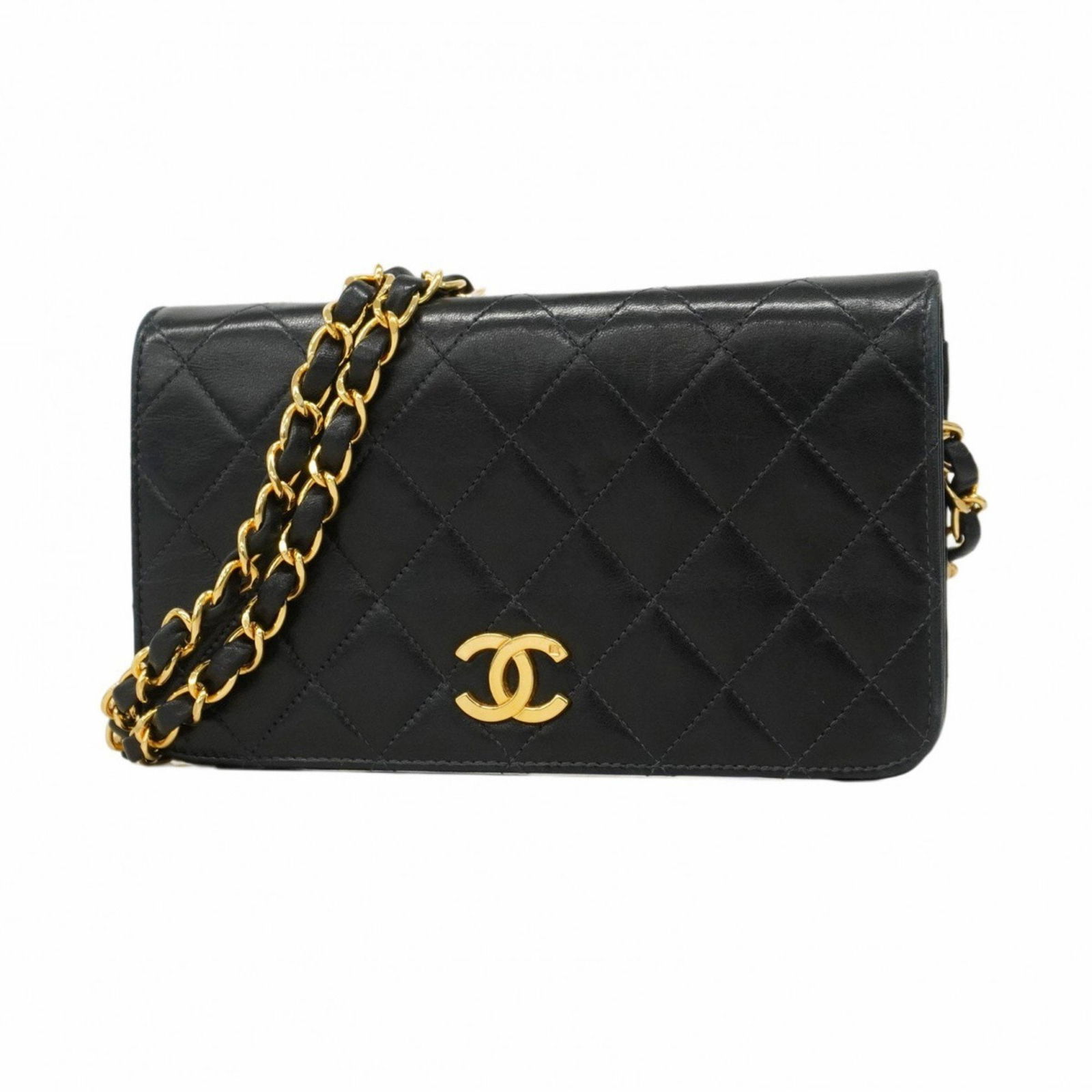 Black Leather Chanel Full Flap Bag 11cm x 19cm: Black Leather Chanel Full Flap Bag 11cm x 19cm This Chanel Full Flap handbag features a black leather exterior and a compact, elegant design. Made in France, it is designed for women and offers both s