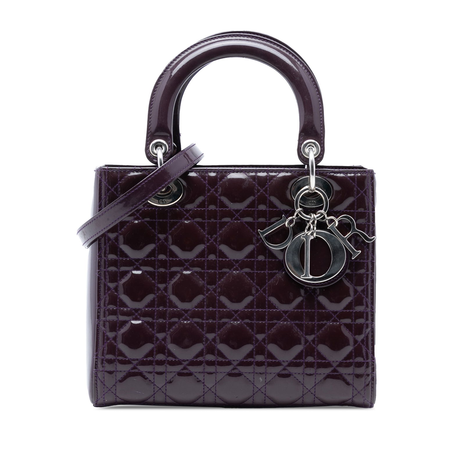 Dior Medium Patent Cannage Lady Dior Bag in Purple: Dior Medium Patent Cannage Lady Dior Bag in Purple The Medium Patent Cannage Lady Dior is a luxurious handbag crafted from quilted patent leather in a stunning purple hue. It features flat leather top