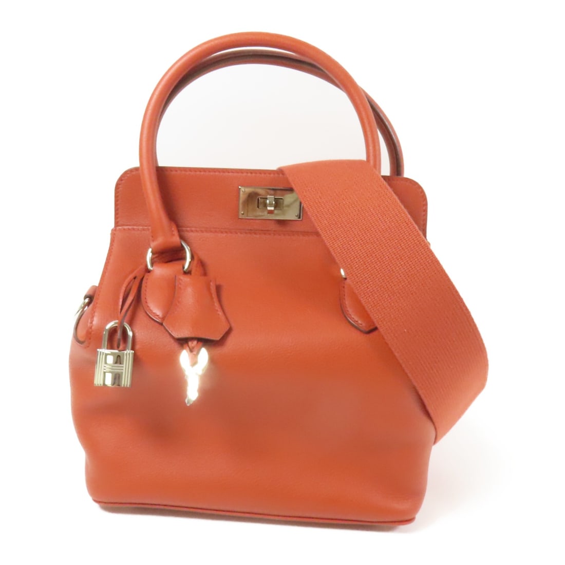 HERMES Tool Box 20 2way Shoulder Bag Evercolor Leather Red: HERMES Tool Box 20 2way Shoulder Bag Evercolor Leather Red Introducing the HERMES Tool Box 20 2way Shoulder Bag, crafted from premium calfskin leather in a vibrant red hue. This versatile bag features