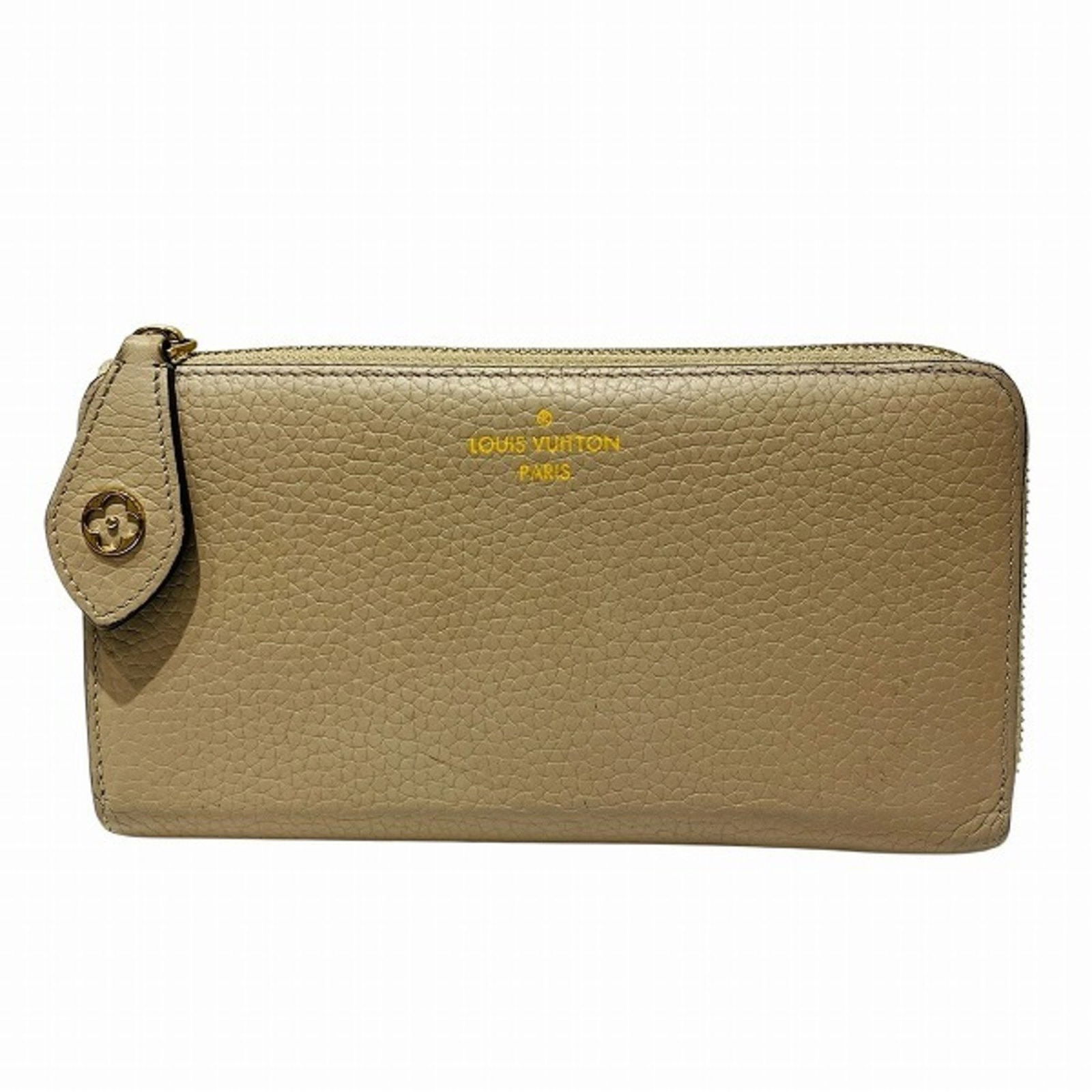 Comete Beige Leather Wallet by Louis Vuitton France: Comete Beige Leather Wallet by Louis Vuitton France The Louis Vuitton Comete is a beige leather accessory crafted for women. This item features a compact design and is made in France. It shows signs o