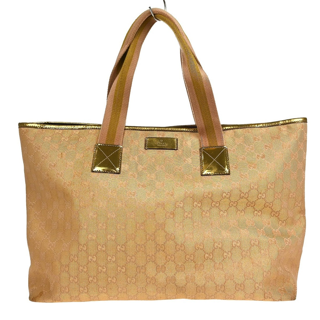 Gucci GG Canvas Vintage Medium Tote Bag in Beige with Leather Trim: Gucci GG Canvas Vintage Medium Tote Bag in Beige with Leather Trim This vintage Gucci tote handbag features the iconic GG pattern in beige canvas with leather accents. It offers a spacious medium size