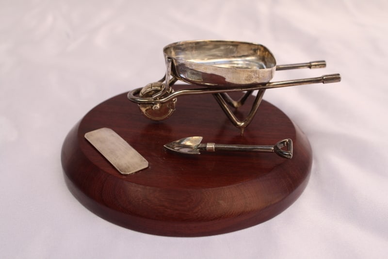 Free Mason Sterling Silver Wheelbarrow Ornament with Wooden Base: Free Mason Sterling Silver Wheelbarrow Ornament with Wooden Base This exquisite Free Mason sterling silver wheelbarrow ornament features a beautifully crafted design, complete with a wooden base. Weig